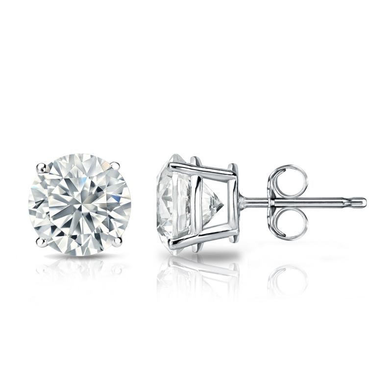 Stunning 14 Karat white gold handmade earrings featuring 2 round brilliant cut diamonds weighing 0.50 carat total I-J color and I1 clarity. These gorgeous earrings are classic and timelessly elegant.