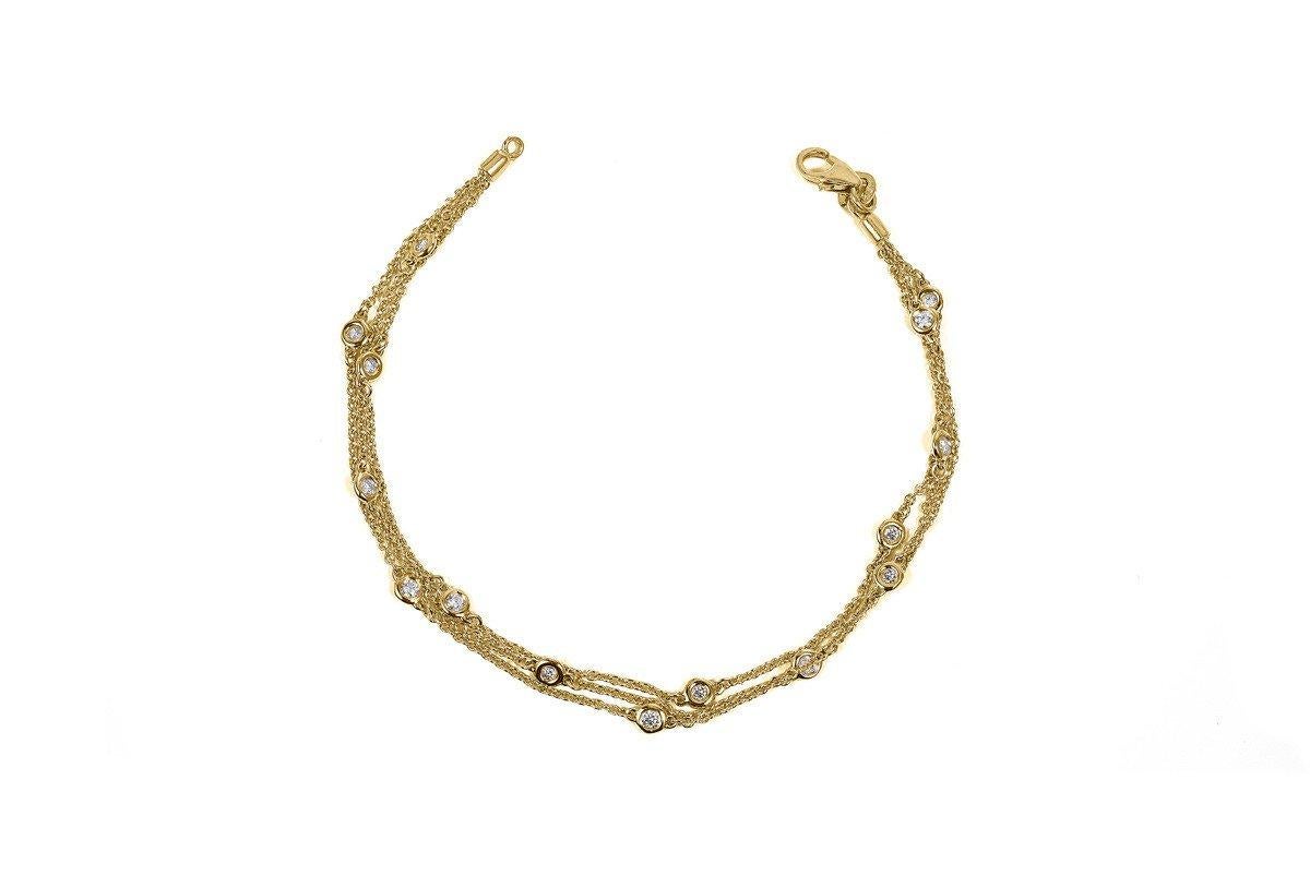 TRIPLE ROW NATURAL DIAMOND BY THE YARD BRACELET 14 KARAT YELLOW GOLD.

7 Inches
0.50 cttw
15 Stations