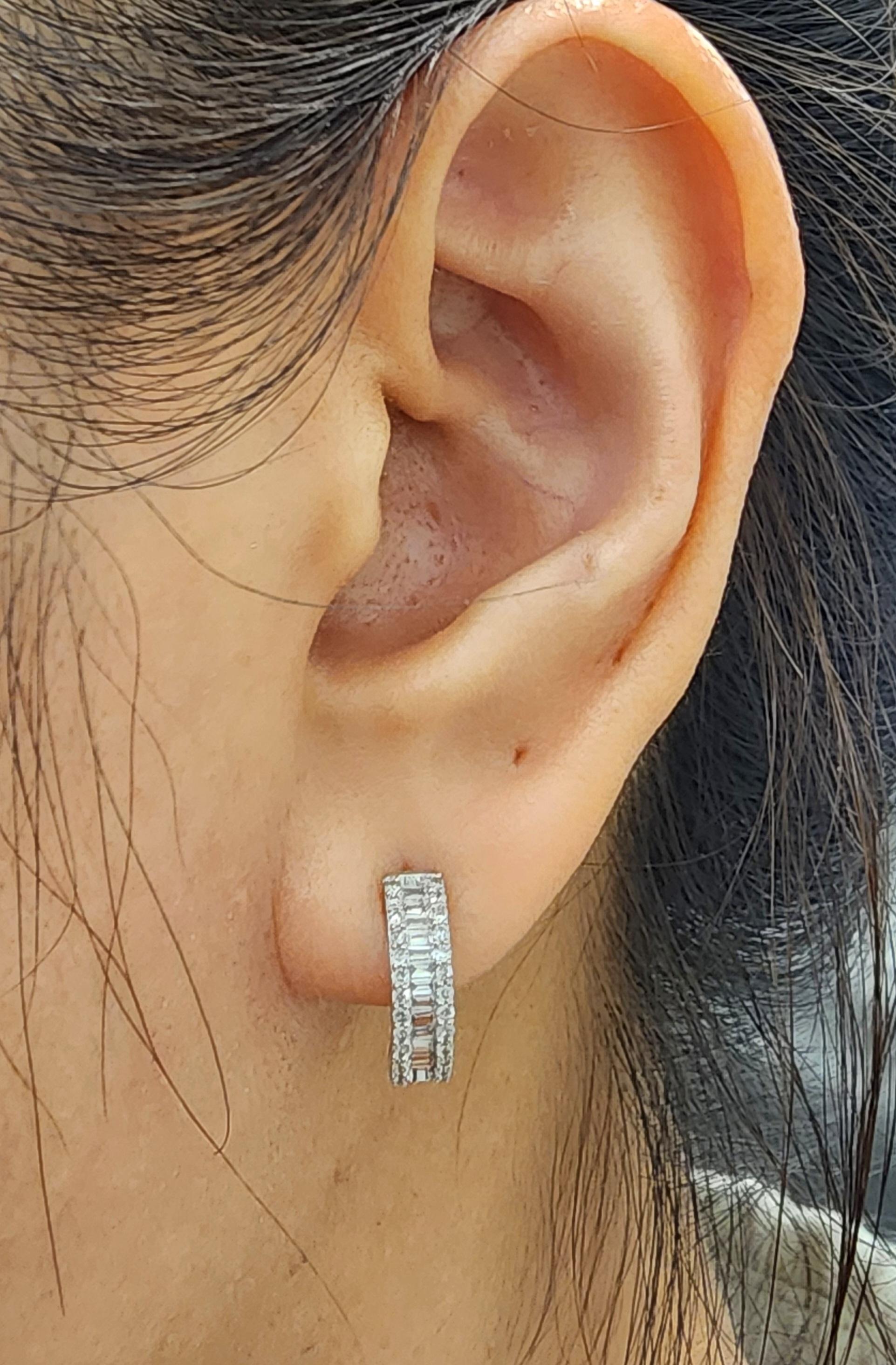 These gorgeous diamond huggies feature 0.50 ct of rounds and baguettes set in 14k white gold. The diamonds boast a color of G/H and SI2 in clarity. Such beautiful earrings to dress up any wardrobe, or for everyday.