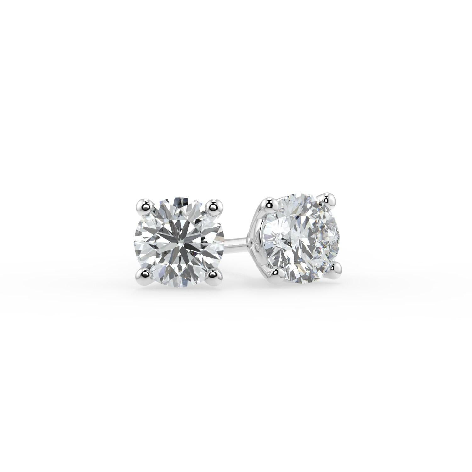 0.50Ct Natural White Diamond  I1 Clarity Round Shape Solitaire 4 Prong Martini Style  Unisex Studs with Butterfly Pushbacks 14K White Gold 
Specifications:
Metal: 14k white gold 
Diamond Shape: Round
Natural Diamond carat weight: 0.50CTW
Diamond