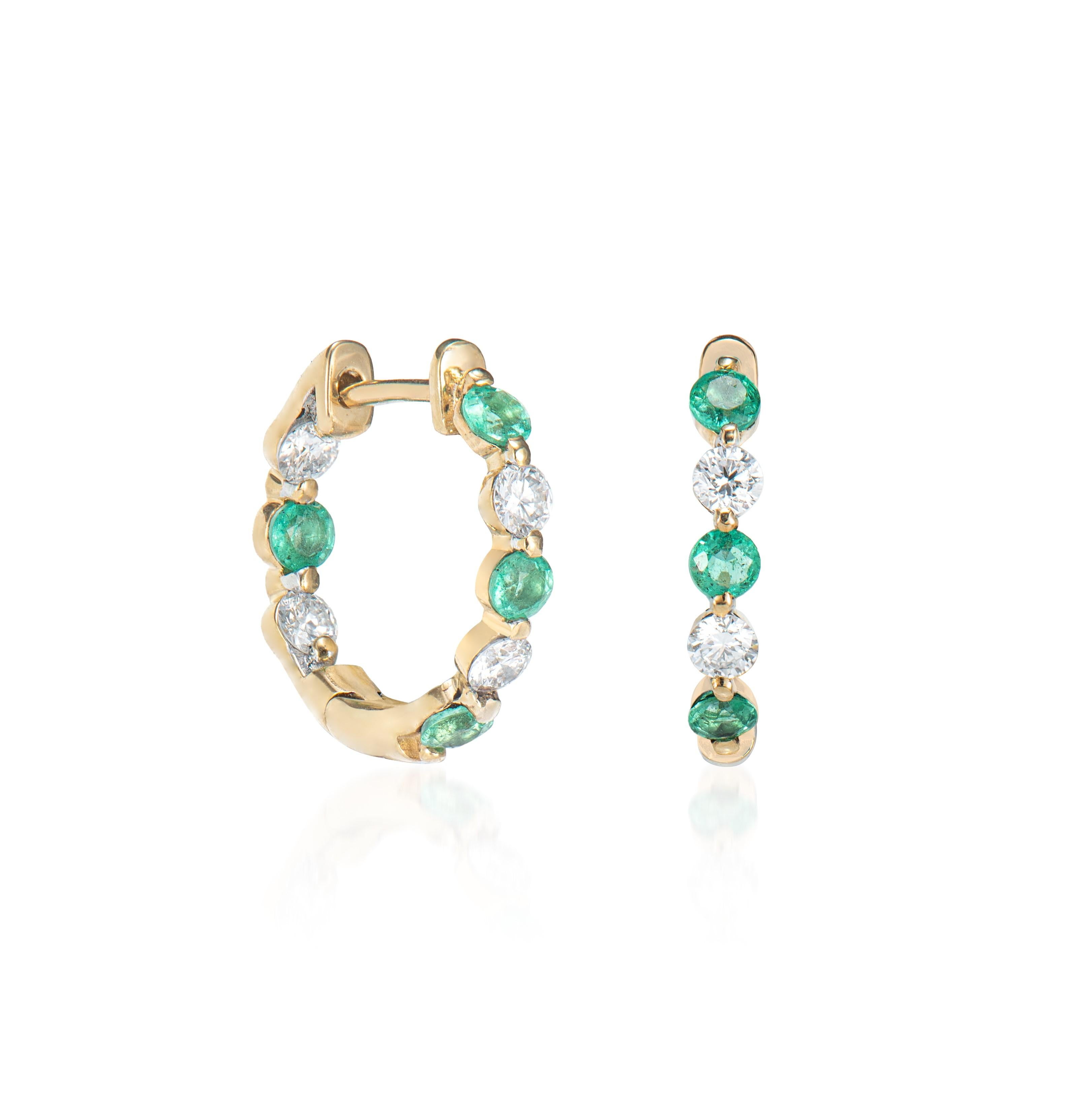 These are Classic Hoop earrings in a Round shape. The hoops earrings are elegant and can be worn for many occasions. Accented with White Diamonds these Hoop Earrings are made in yellow gold and present a classic yet elegant look. 

Emerald Hoop
