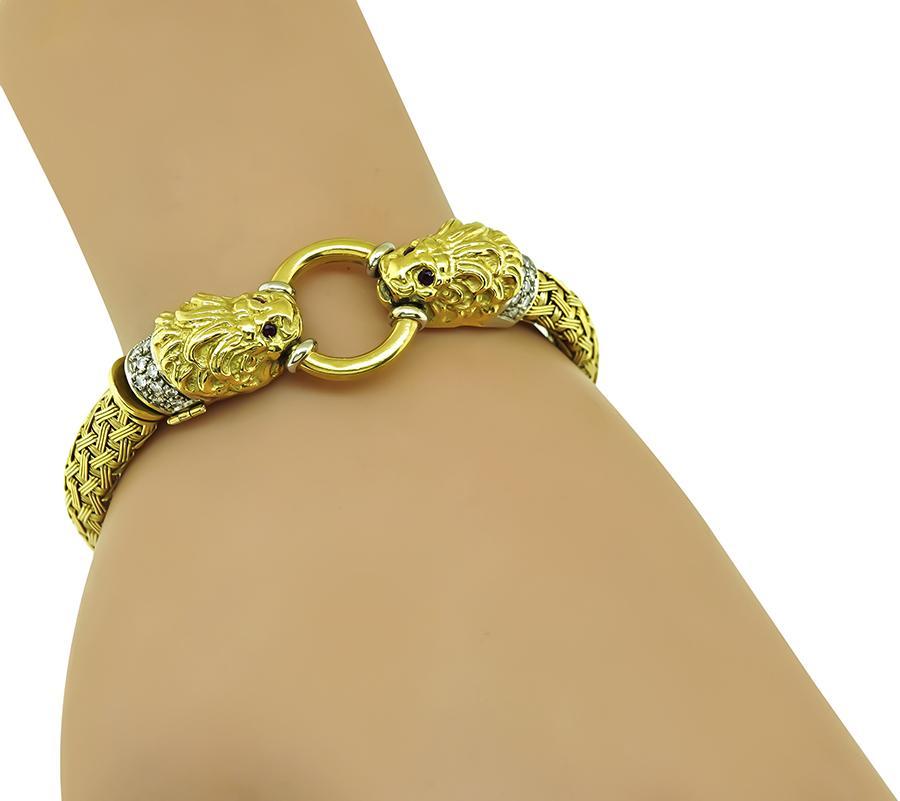 This is a gorgeous 18k yellow and white gold bracelet. The bracelet is set with sparkling round cut diamonds that weigh approximately 0.50ct. The color of these diamonds is H with VS clarity. The diamonds are accentuated by lovely round cut ruby