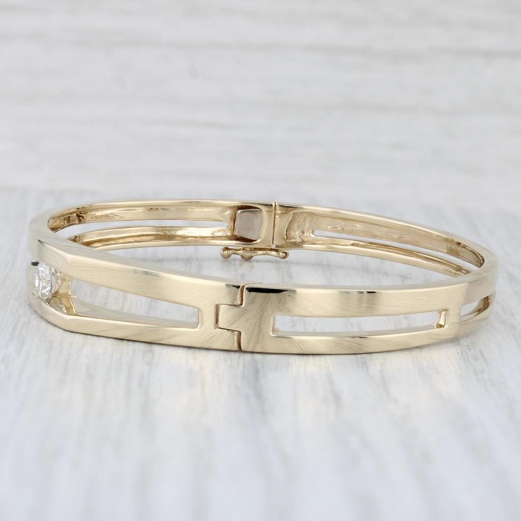 Gemstone Information:
- Natural Diamond -
Carats - 0.50ct 
Cut - Round Brilliant
Color - G - H
Clarity - SI1

Metal: 14k Yellow Gold
Weight: 24.6 Grams 
Stamps: 14k
Chain Style: Bangle
Closure: Hinged with snap and latch
Inner Circumference: 6