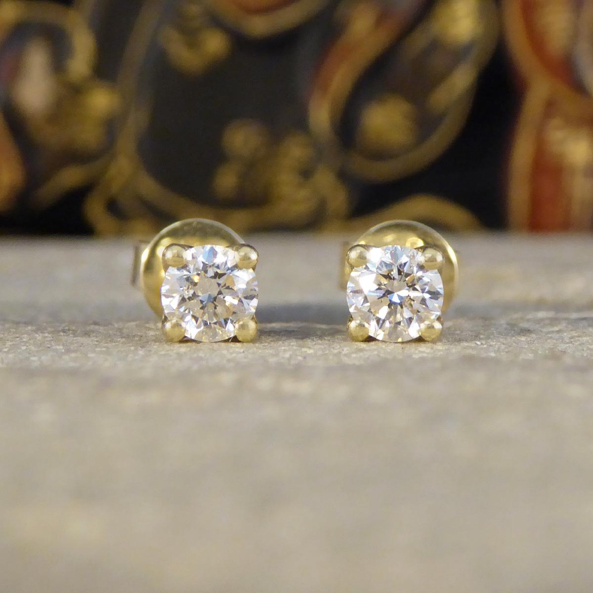 The perfect pair of stud earrings for everyday wear. Each stud is set with a Round Brilliant Cut Diamond, matching well in colour and clarity with a warm feel in Yellow Gold and weighing a total of 0.50ct. Each Diamond sits in a 9ct Yellow Gold four