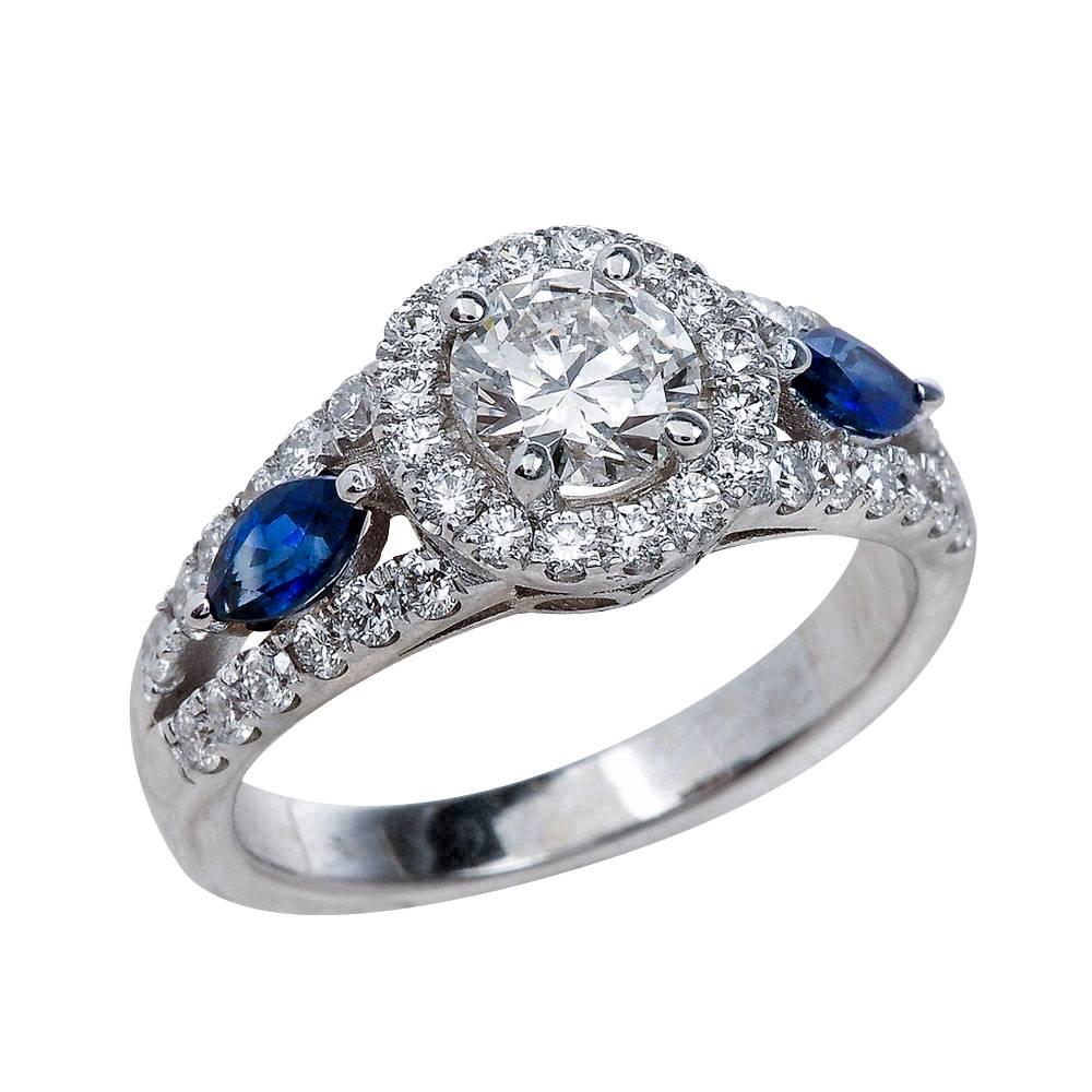 0.50 Carat Round Cut Moissanite Ring with Blue Sapphires in 14 Karat Gold For Sale