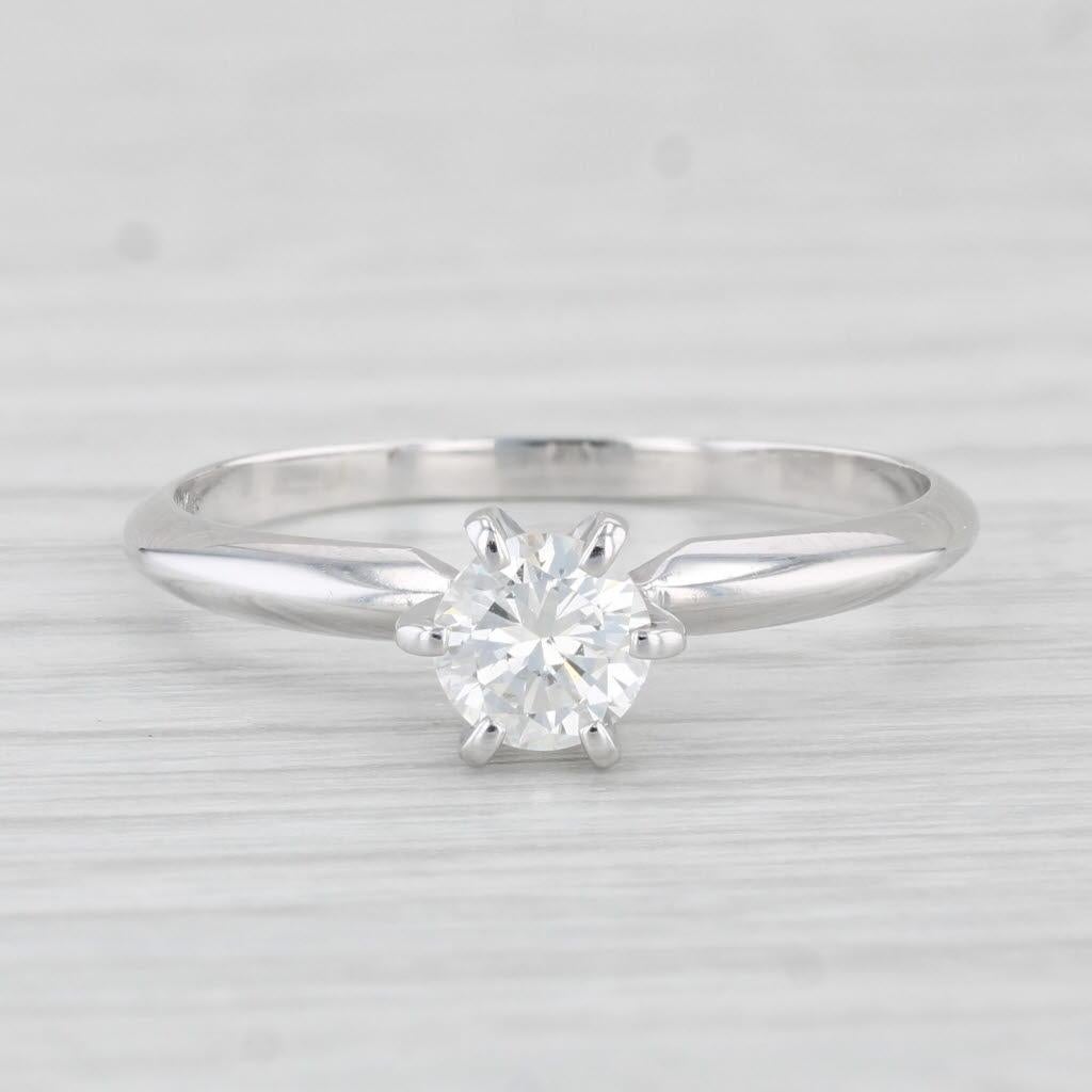 Gemstone Information:
- Natural Diamond -
Carats - 0.50ct 
Cut - Round Brilliant
Color - J
Clarity - SI2 
Please note there is a small chip to the girdle.

Metal: 14k White Gold
Weight: 2.3 Grams 
Stamps: 14k
Face Height: 6 mm 
Rise Above Finger:
