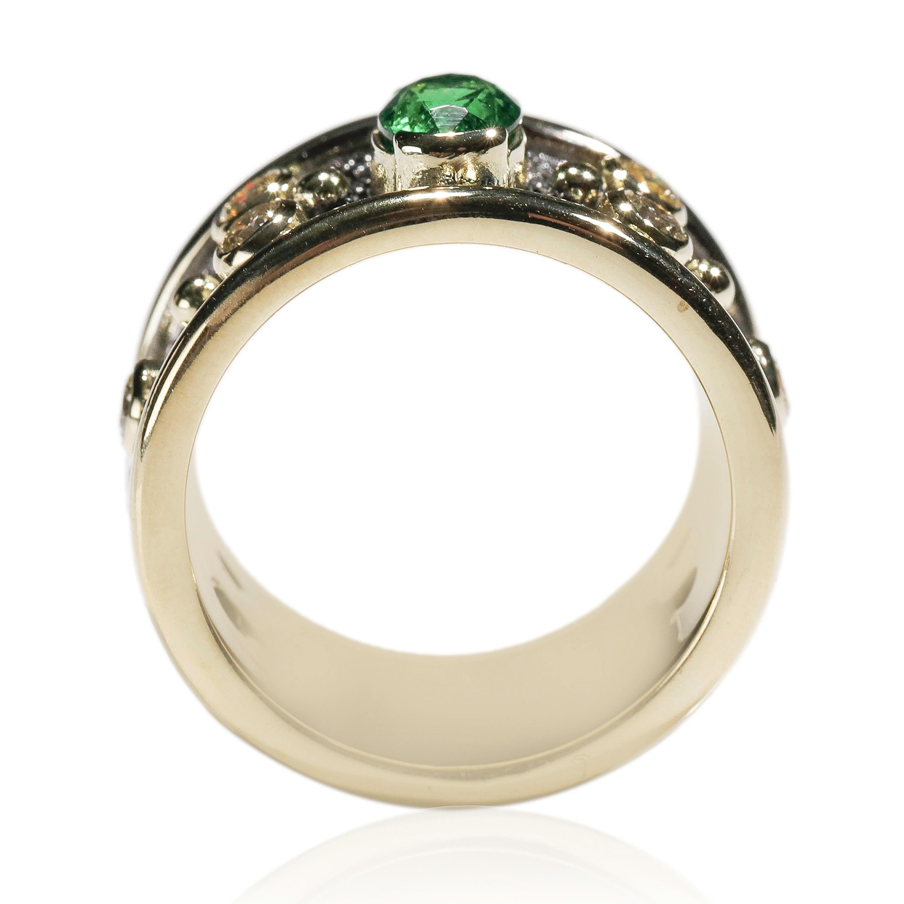 0.50Ct Tsavorite 1 Ct Diamond 18k Yellow Gold Cigar Band Ring US Size 7 

Crafted in 18 kt Yellow Gold, this Unique design showcases a white Diamond 1 TCW Round-shaped diamonds, set in yellow gold, fine Oval shape mesmerizing 0.50ct tsavorite,