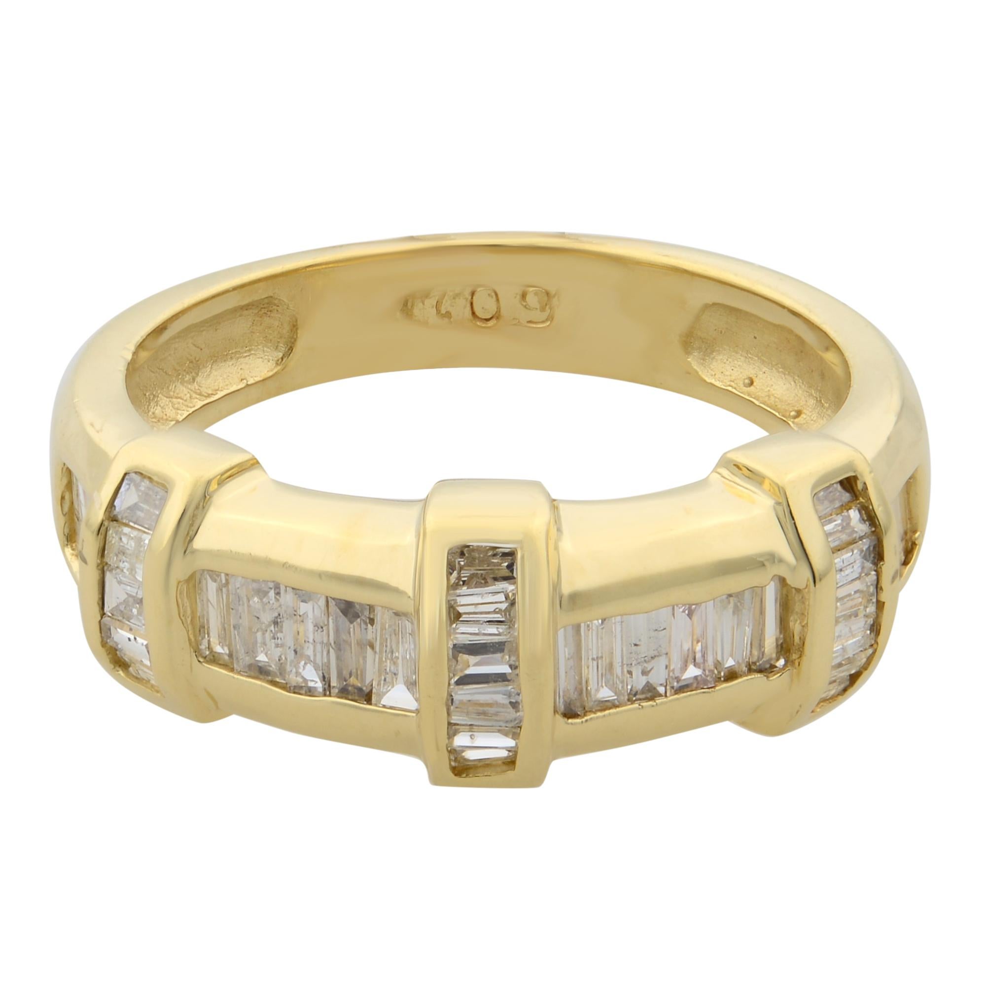 This beautiful band ring features white baguette cut diamonds lined up in a channel setting to create a faceted passageway that glimmers as it bends around the finger. Crafted in high polished 14k yellow gold. Diamond color I-J and I clarity. Total