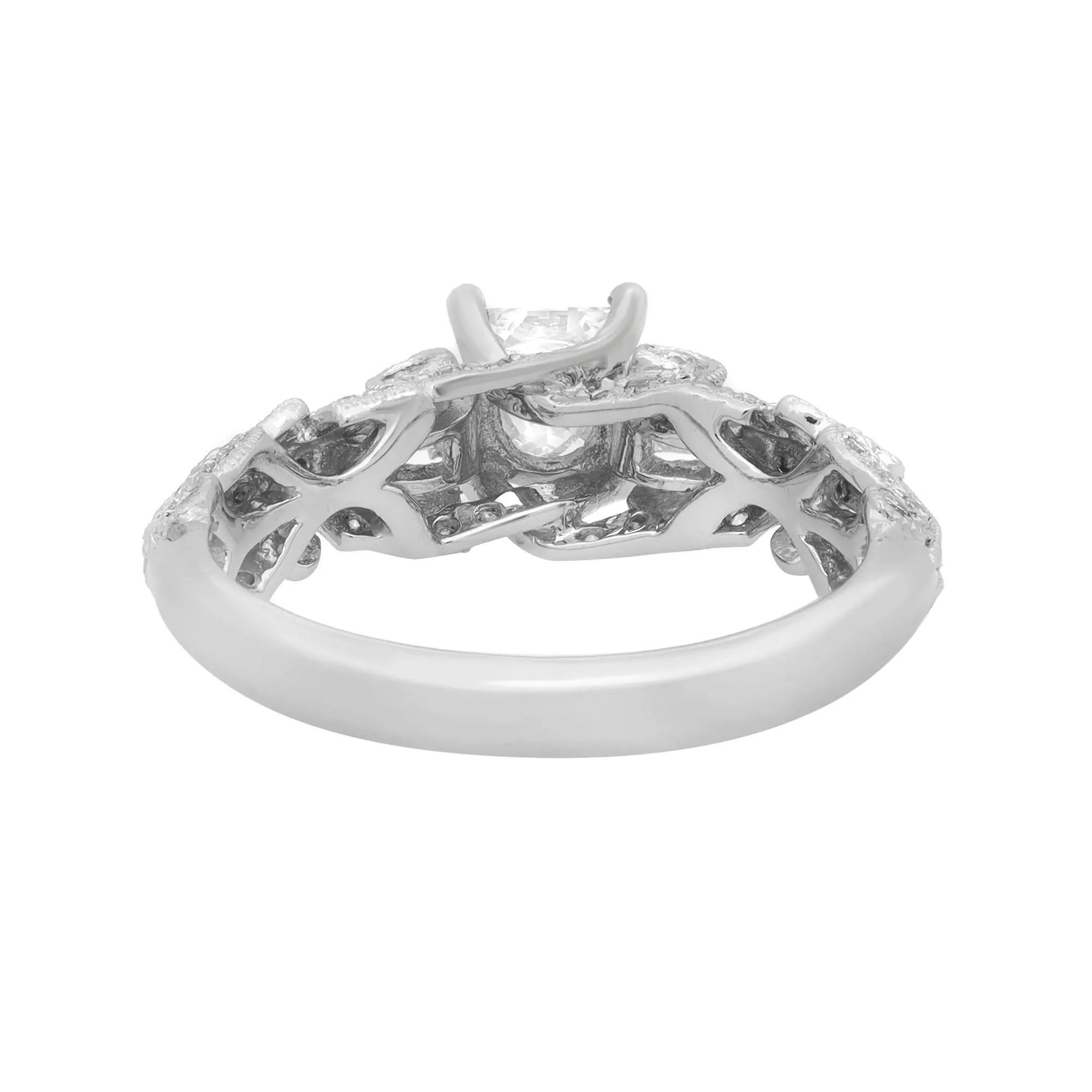Truly a stunning treasure, this captivating princess cut diamond engagement ring is crafted in 18K white gold. It features a sparkling center princess cut diamond in a four-prong setting weighing 0.50 carat. Accenting the shine, glittering pave set