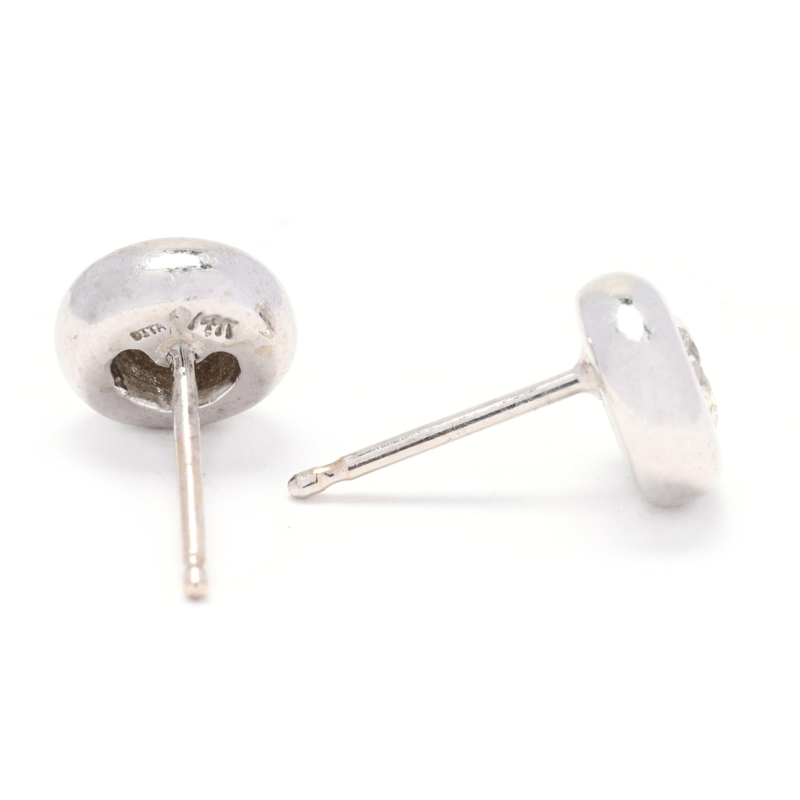 Stones: 
- diamonds, 2 stones
- round brilliant cut
- 4 mm
- approximately .50 total carats
- H-I color, SI2-I1 clarity

Length: 6.9 mm

Weight: 1.3 dwts. / 2 grams

Stamps: 