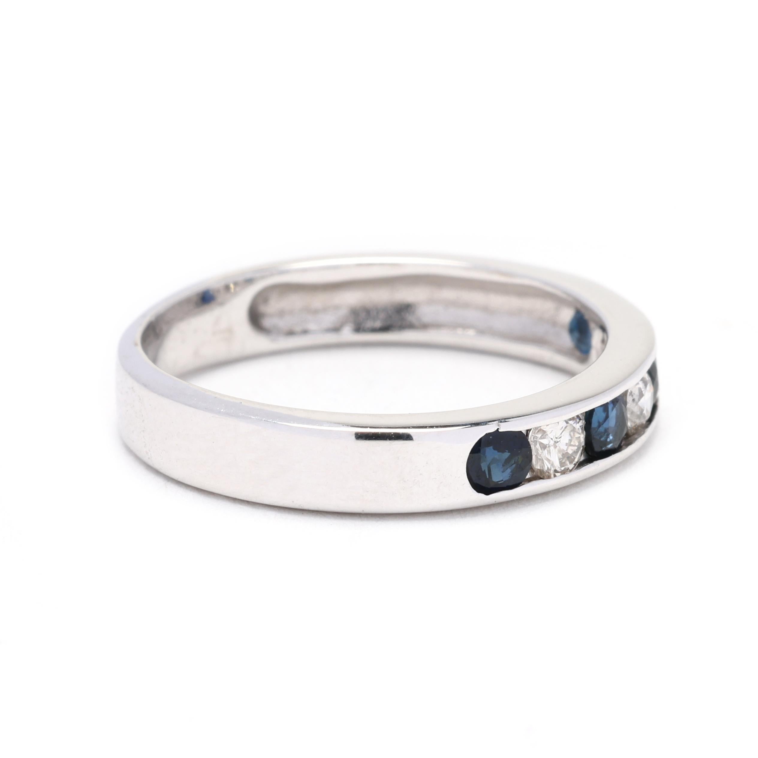This beautiful 0.50ctw diamond and sapphire band ring is crafted in 14K white gold and is a size 5. It is the perfect stacking ring to add to your collection. The ring features alternating round diamonds and sapphires, creating a stunning and
