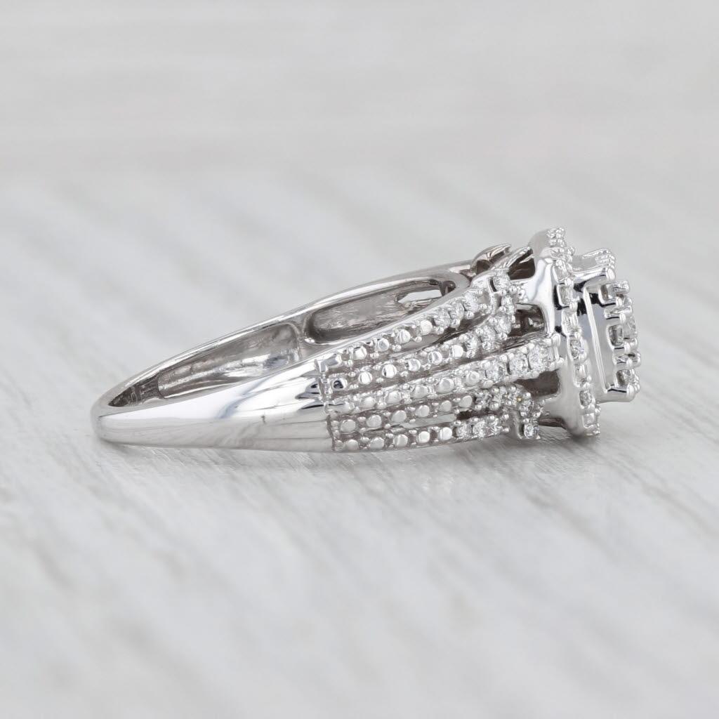 Gemstone Information:
- Natural Diamonds -
Total Carats - 0.50ctw
Cut - Round Brilliant
Color - H - I
Clarity - I1 - I2

Metal: 10k White Gold
Weight: 3.8 Grams 
Stamps: 10k
Face Height: 10 mm 
Rise Above Finger: 8.5 mm
Band / Shank Width: 2.1