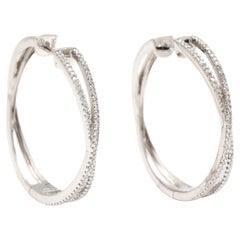 Grandes créoles croisées avec diamants 0,50 carat, or blanc 14 carats