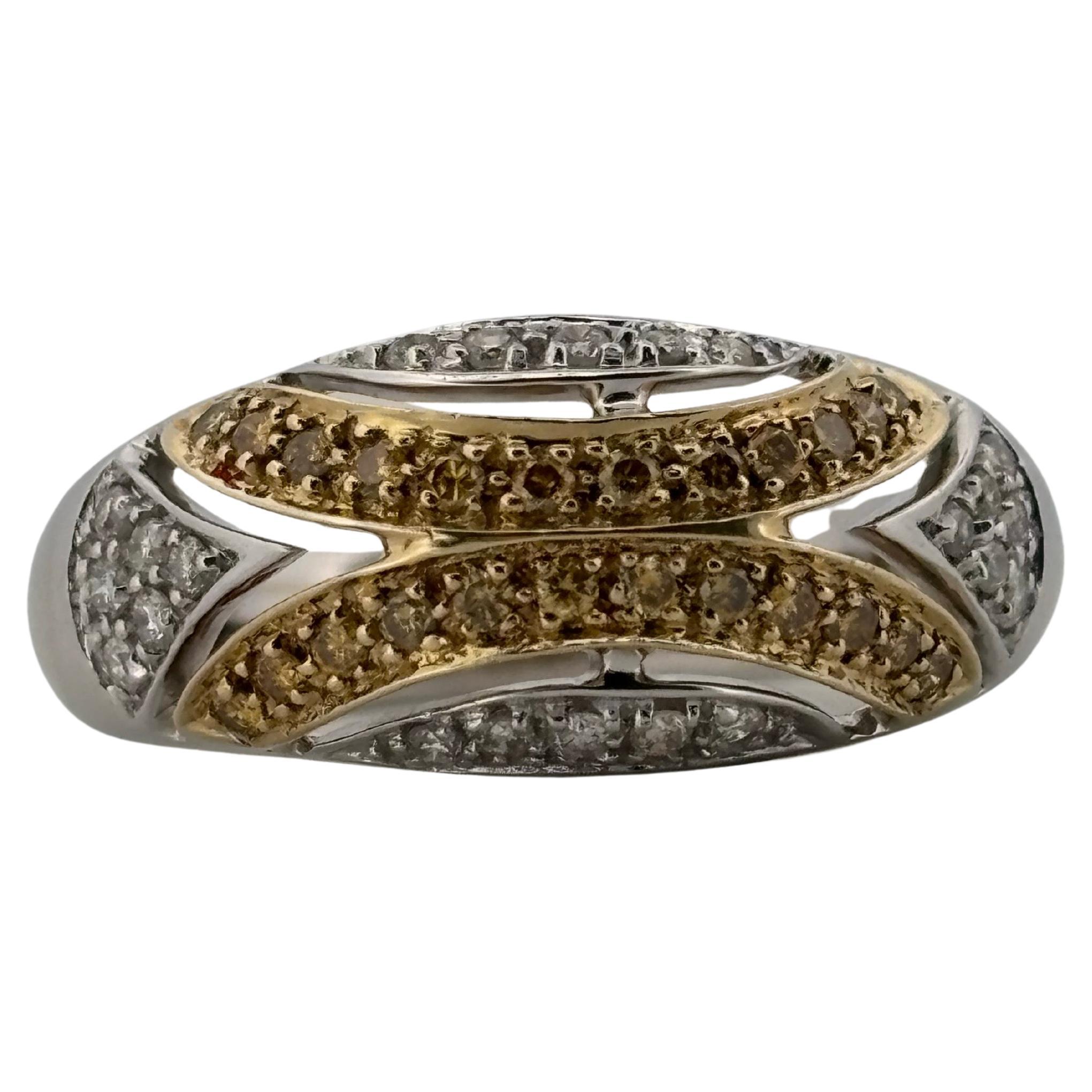 This elegant 14k white and yellow gold ring showcases a striking two-tone design that highlights its brilliance and craftsmanship. Measuring a size 7 and weighing 4.7 grams, the ring is set with approximately 0.50 carats total weight of natural