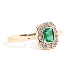0.51 Carat Emerald and Diamond Vintage 9 Carat Yellow Gold Halo Cluster Ring