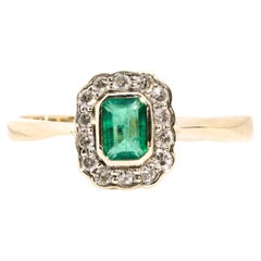 0.51 Carat Emerald and Diamond Vintage 9 Carat Yellow Gold Halo Cluster Ring