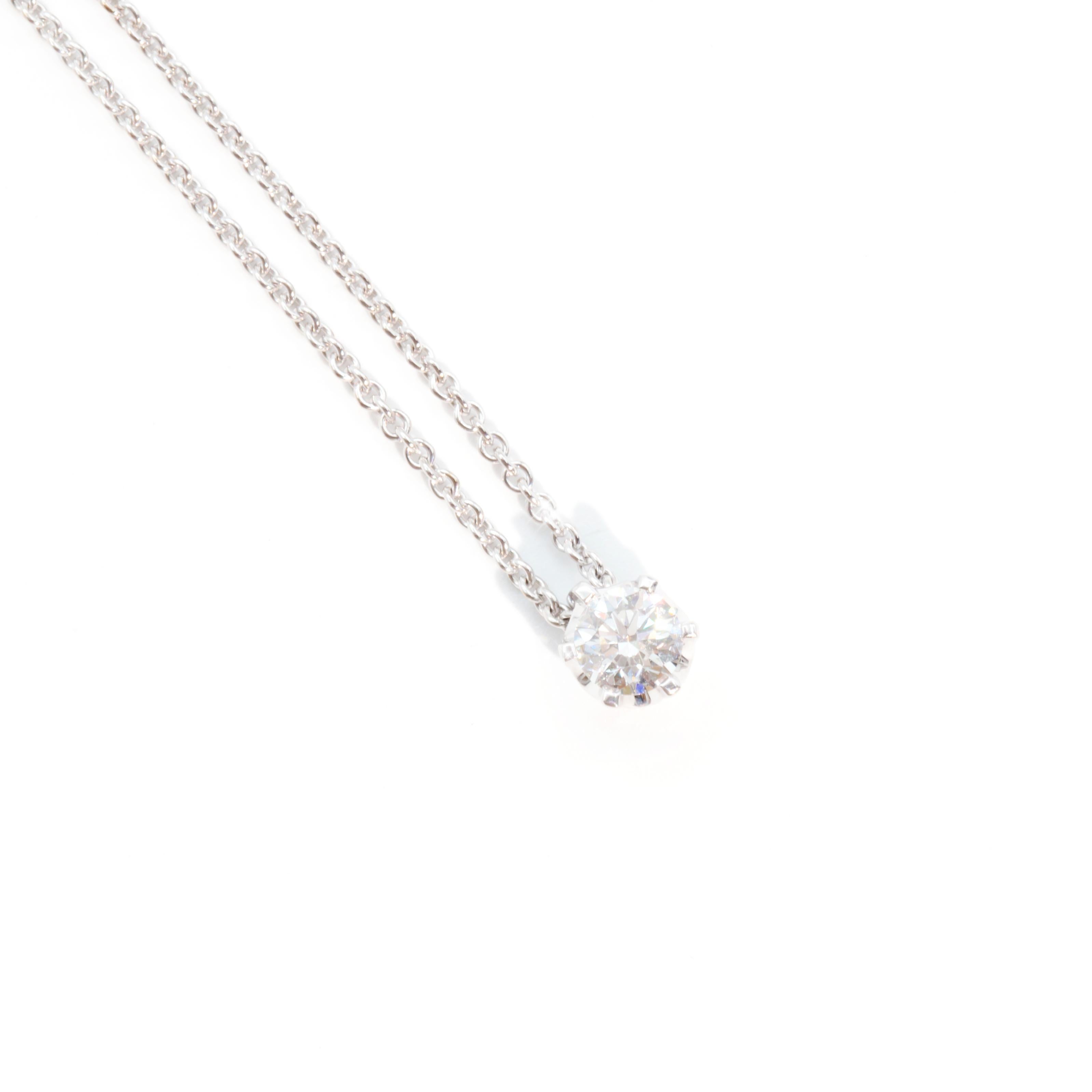 Carefully crafted in 18 carat white gold sweet vintage necklace featuring a glittering sliding bright round brilliant cut diamond.  The pendant is attached to a gorgeous fine 18 carat white gold curb link chain fitted with a lobster clasp. We have