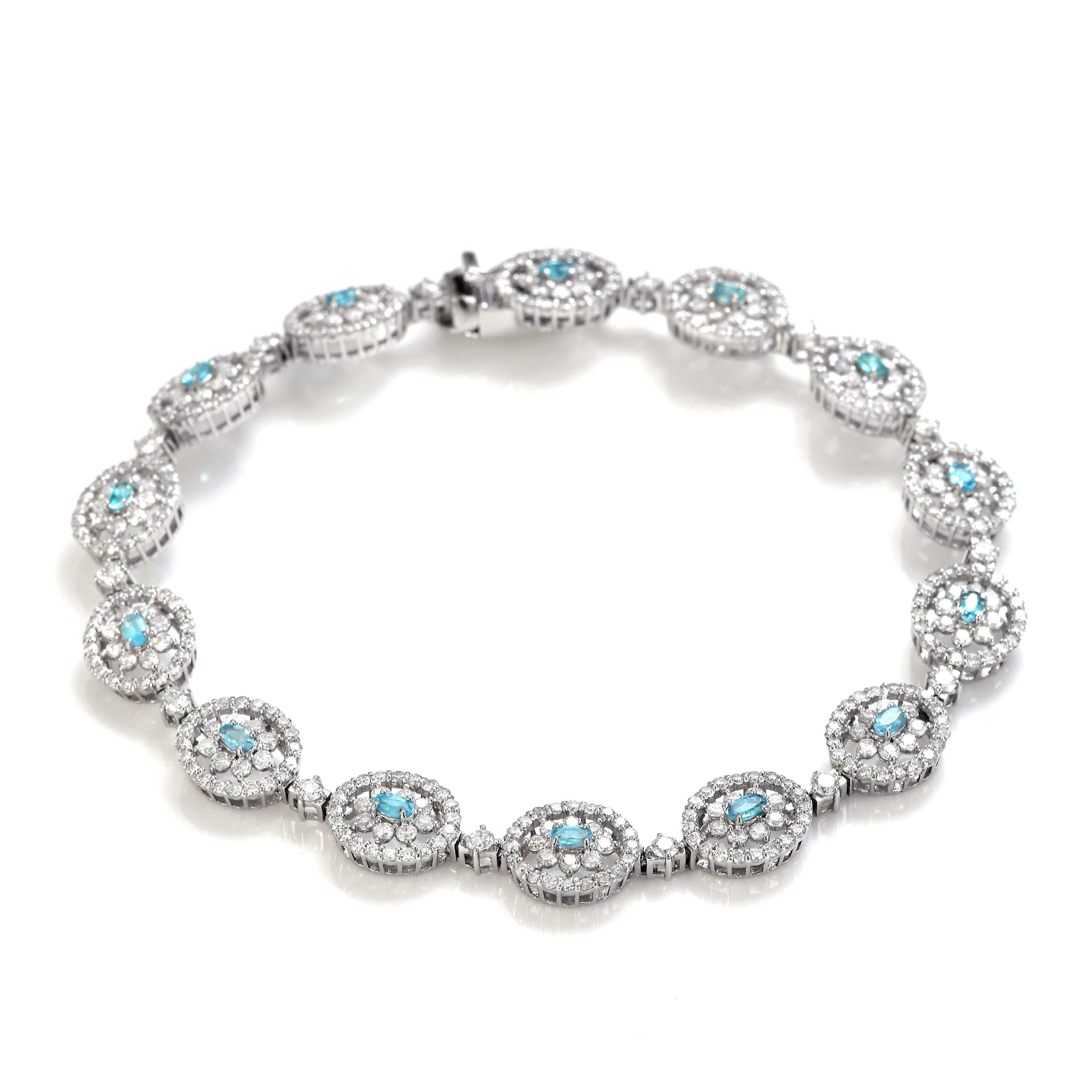 A beautiful Bracelet featuring 0.51 Carats of Natural, Neon Blue Brazilian Paraiba Tourmaline and 2.78 Carats of Diamond Accents made in Platinum. Paraiba Tourmalines were only discovered 30 years ago in the Brazilian state of the same name-
