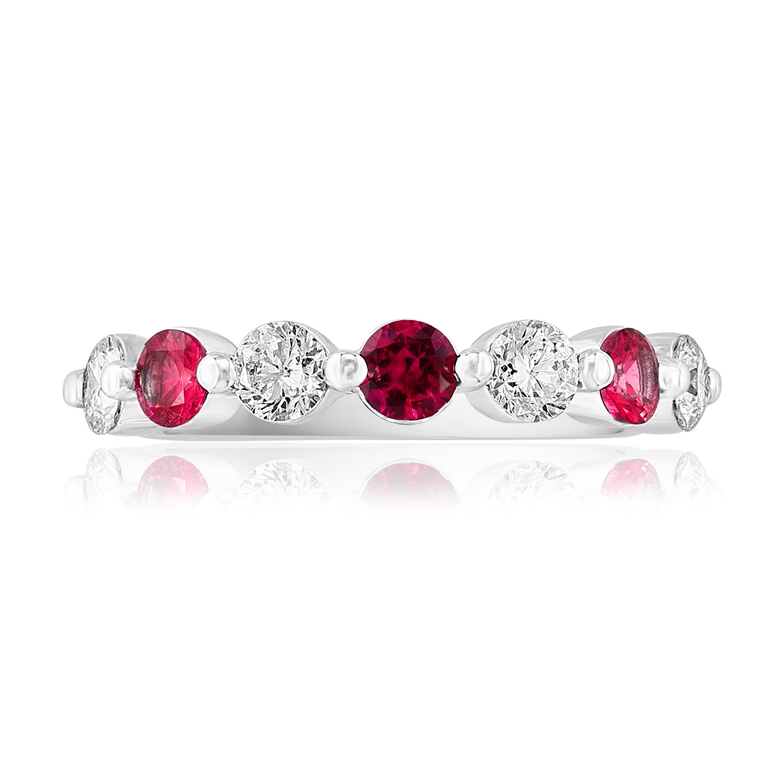 A fashionable and classic wedding band showcasing 4 brilliant cut diamonds weighing 0.62 carats total alternating with 3 round rubies weighing 0.52 carats. Stones secured with a shared prong setting made with 14K white gold. A versatile piece that