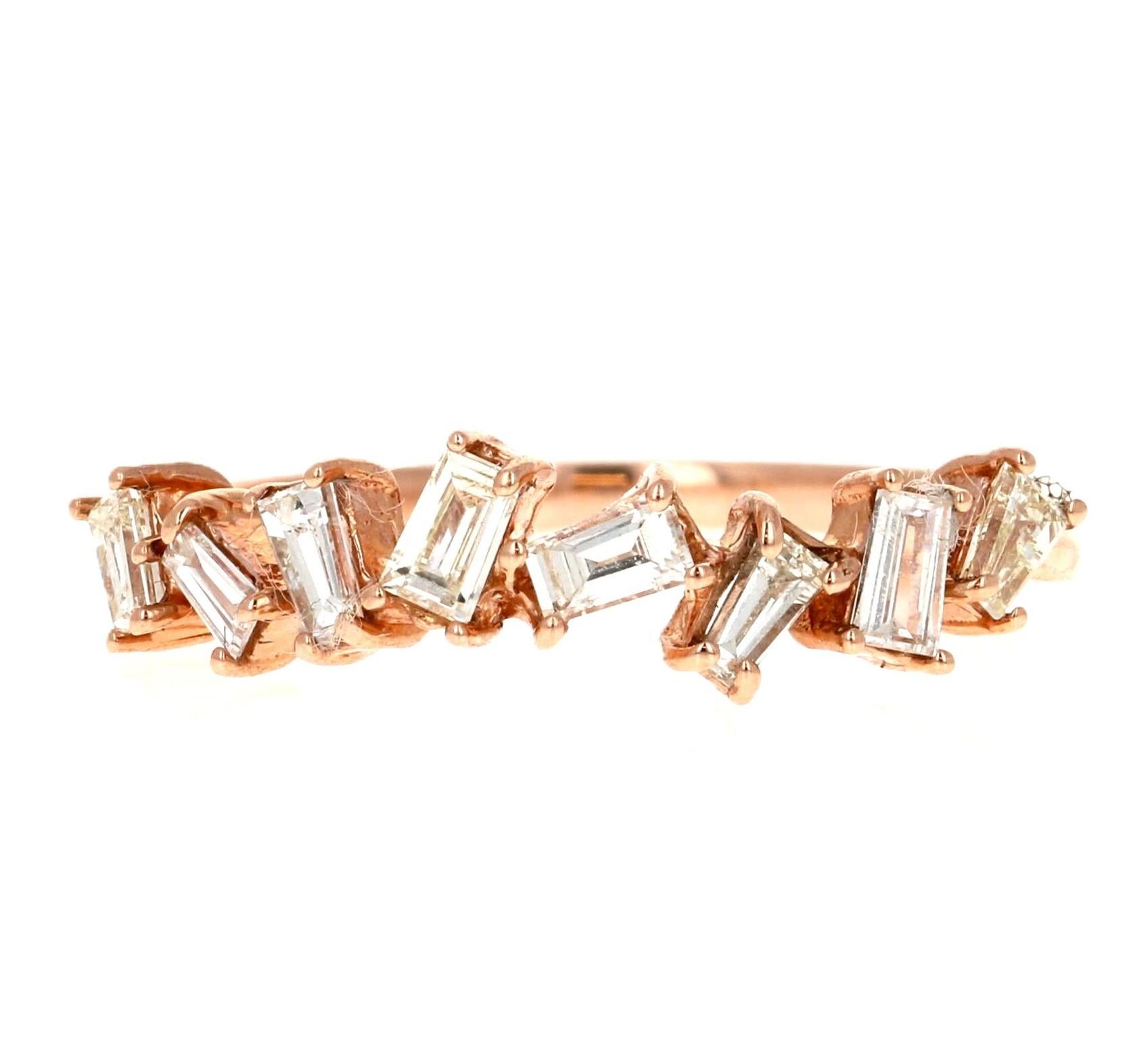 0.52 Carat Baguette Diamond Rose Gold Band Ring

This elegant band ring by Roshe Jewels showcases 0.52 carats of baguette-cut white diamonds. The diamonds are set in a sleek, contemporary design, highlighting their clarity of VS2 and color grade I.