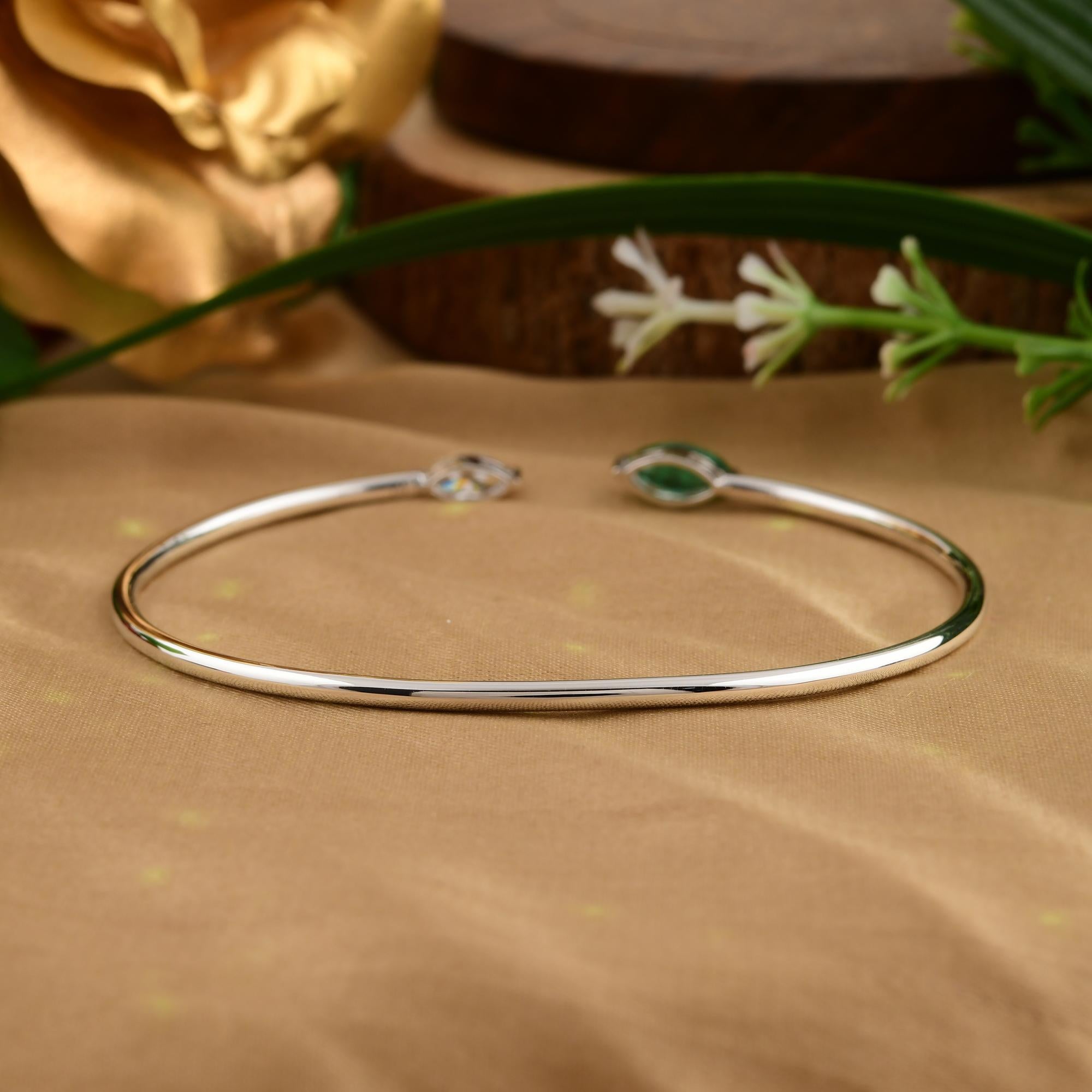 Cast from 18-karat gold, these exquisite bangle is handset with 0.52 carat Zambian emerald and 0.31 carats of sparkling diamonds.

FOLLOW SPECTRUM JEWELS storefront to view the latest collection & exclusive pieces. Spectrum Jewels is proudly rated
