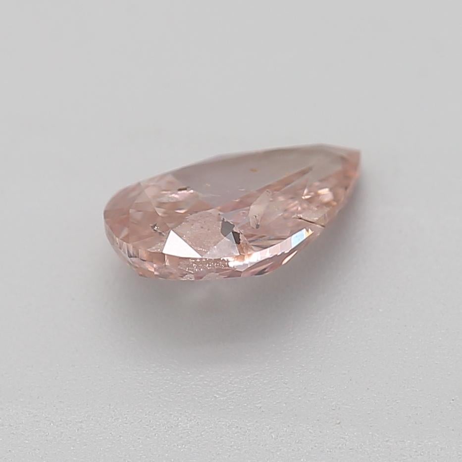Women's or Men's 0.52 Carat Fancy Orangy Pink Pear Cut Diamond I2 Clarity GIA Certified For Sale