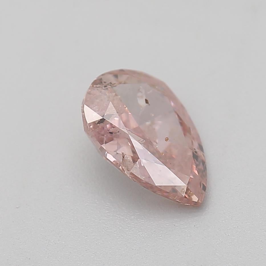 0.52 Carat Fancy Orangy Pink Pear Cut Diamond I2 Clarity GIA Certified For Sale 1