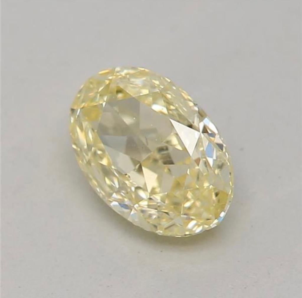 Oval Cut 0.52 Carat Fancy Yellow Oval shaped diamond SI1 Clarity GIA Certified For Sale