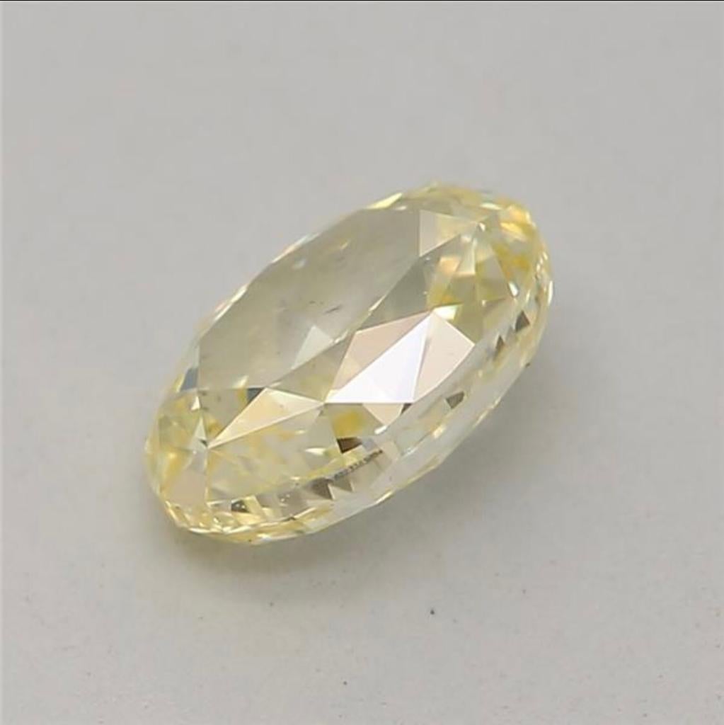 0.52 Carat Fancy Yellow Oval shaped diamond SI1 Clarity GIA Certified In New Condition For Sale In Kowloon, HK