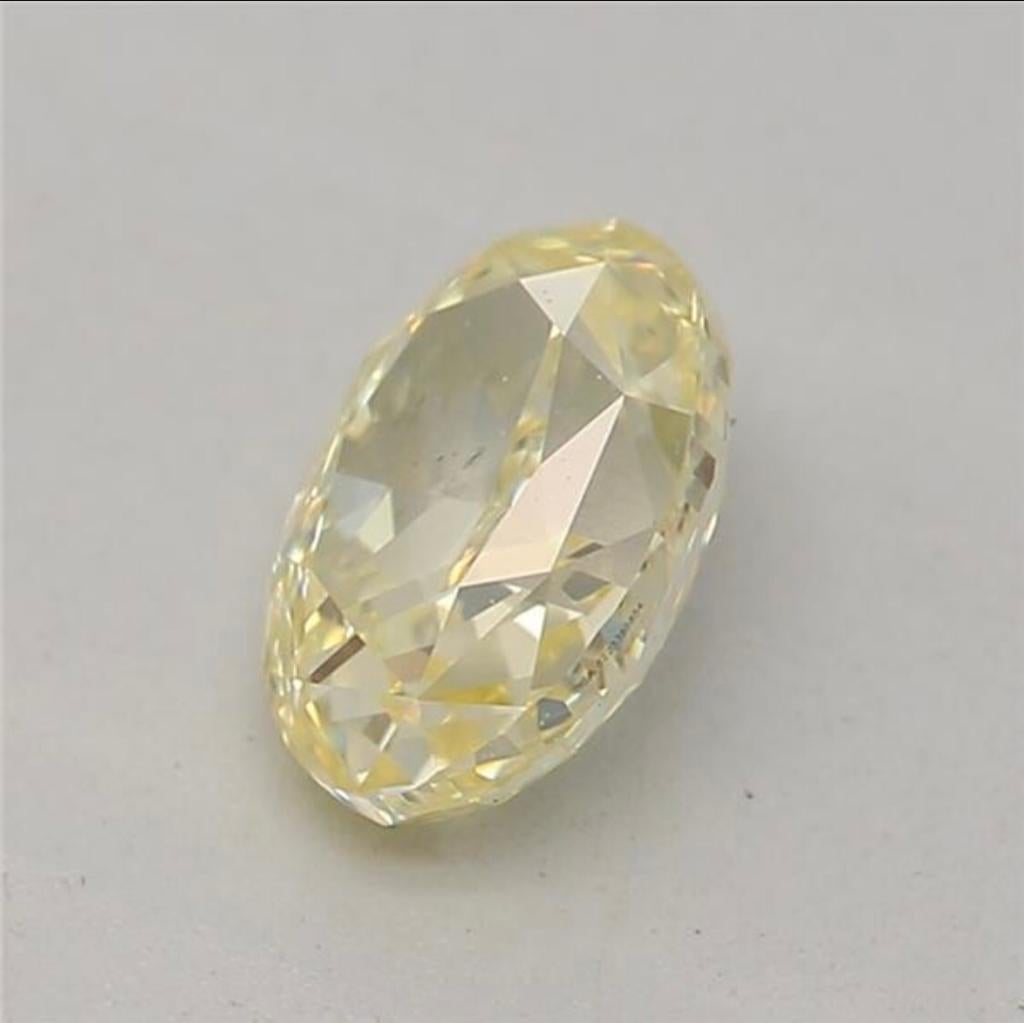Women's or Men's 0.52 Carat Fancy Yellow Oval shaped diamond SI1 Clarity GIA Certified For Sale