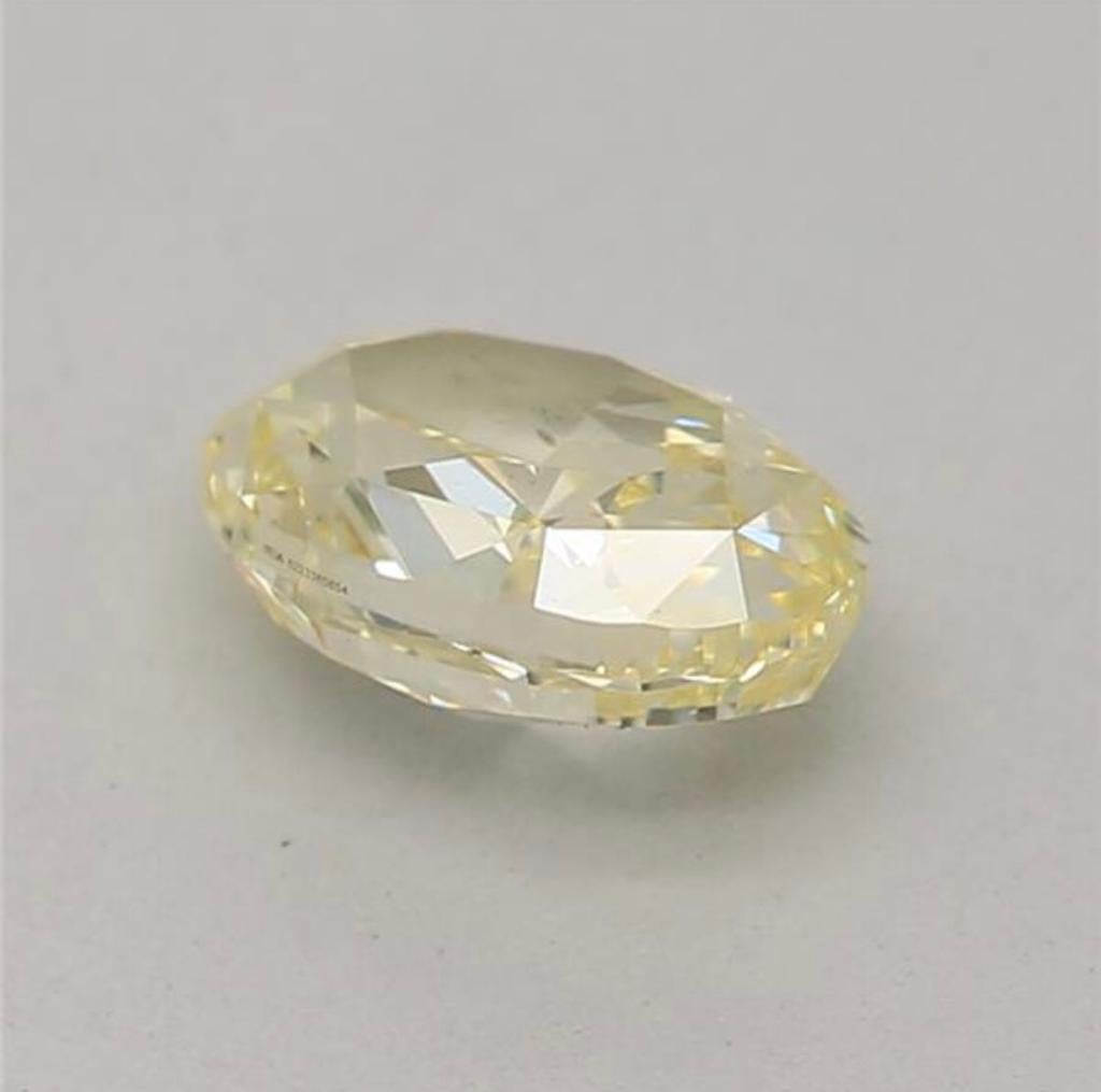 0.52 Carat Fancy Yellow Oval shaped diamond SI1 Clarity GIA Certified For Sale 2