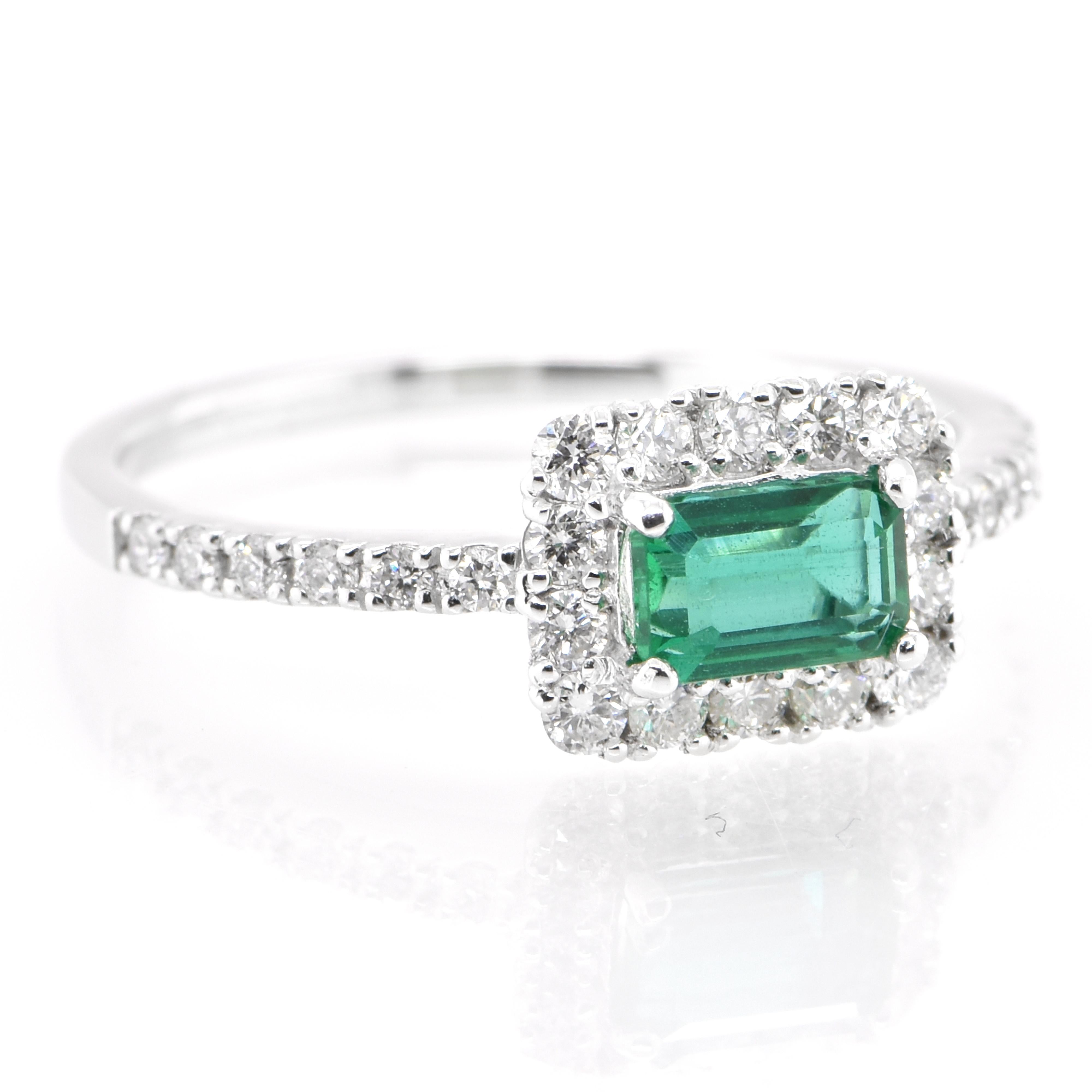 Modern 0.52 Carat Natural Emerald and Diamond Engagement Ring Set in Platinum