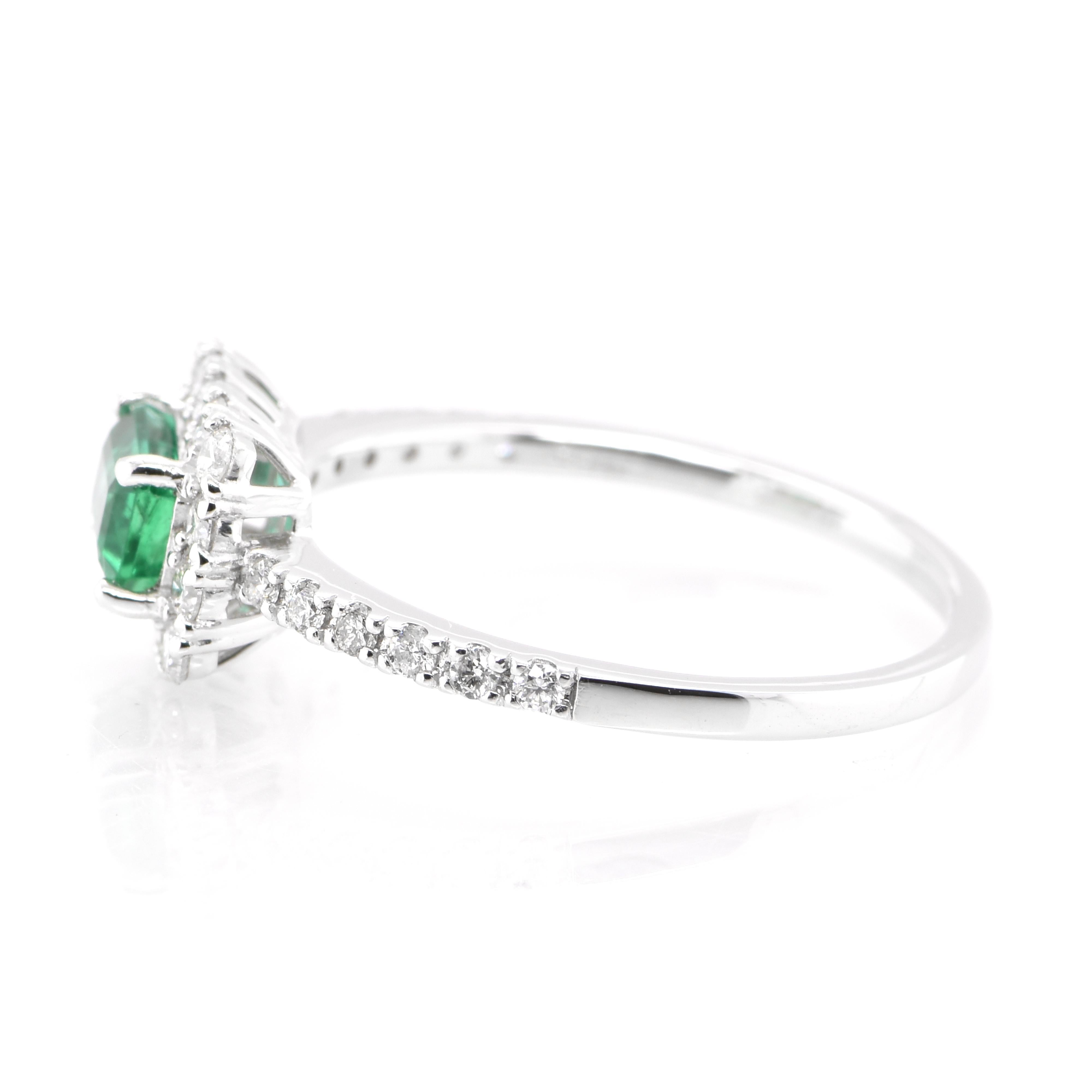Emerald Cut 0.52 Carat Natural Emerald and Diamond Engagement Ring Set in Platinum