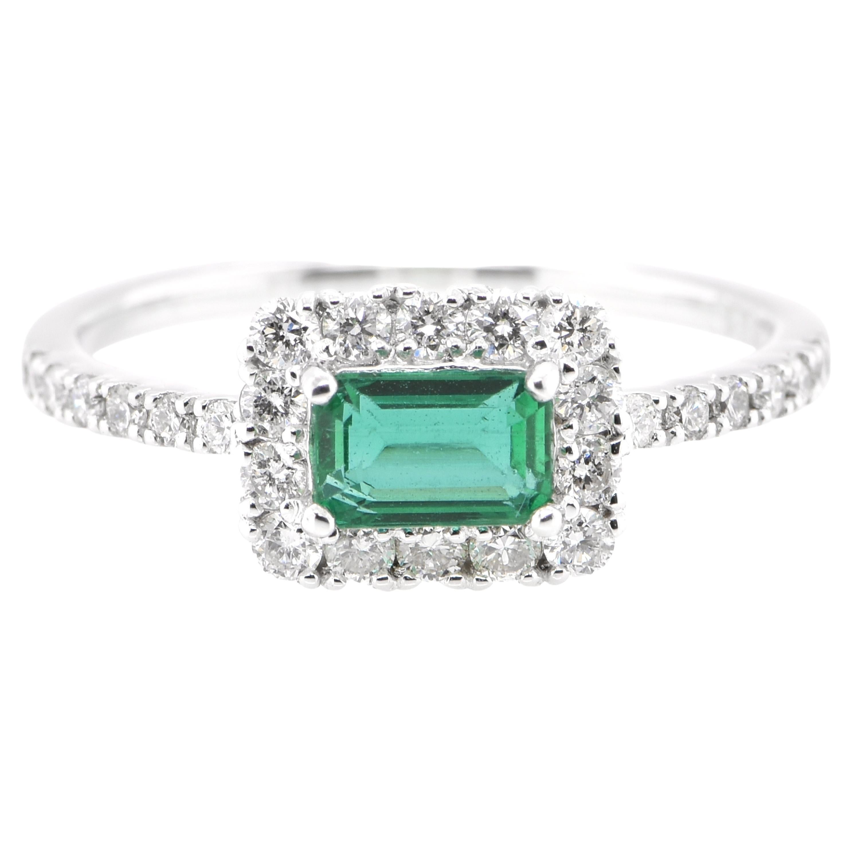 0.52 Carat Natural Emerald and Diamond Engagement Ring Set in Platinum