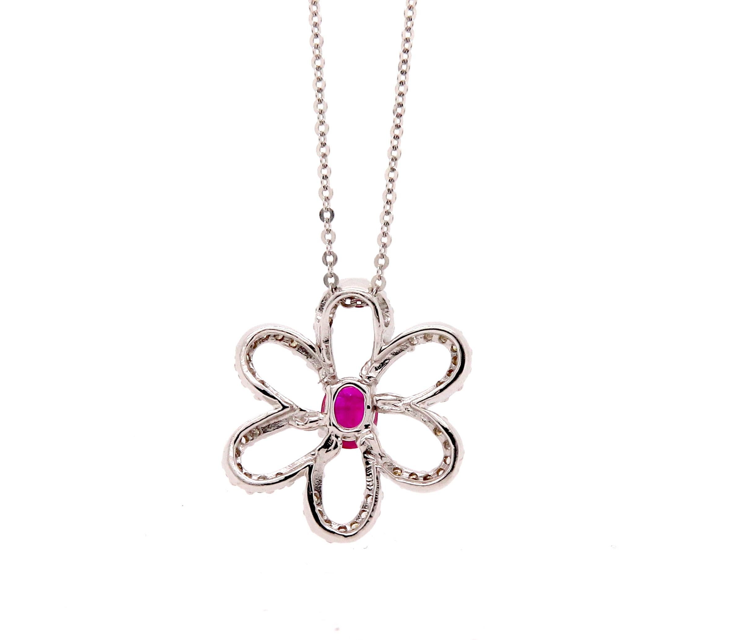 A beautiful and dainty piece, this Flower shaped pendant is made of 14K White Gold adorned with brilliant White Diamonds. Featuring a 0.52 Carat Ruby, this piece lights up any look! 

Material: 14k White Gold 
Main Stone Details: 1 Oval Shaped Ruby
