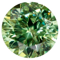 Pierre précieuse non sertie d'une queue de cheval incluse, grenat démantoïde russe de 0.52 carat