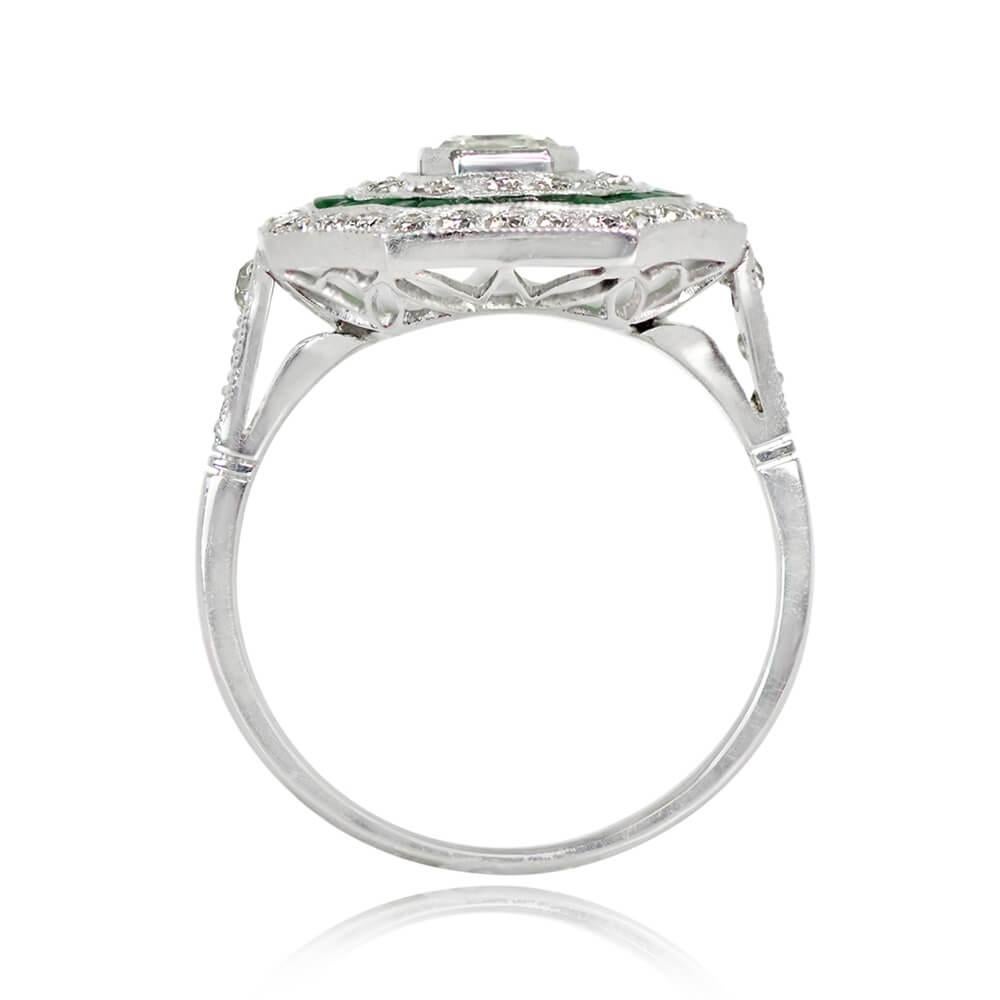 An Art Deco-inspired ring featuring an Asscher cut diamond of 0.52 carats, J color, and VS2 clarity at its center. The diamond is embraced by halos of old European cut diamonds and natural calibre emeralds. Old European cut diamonds also grace the