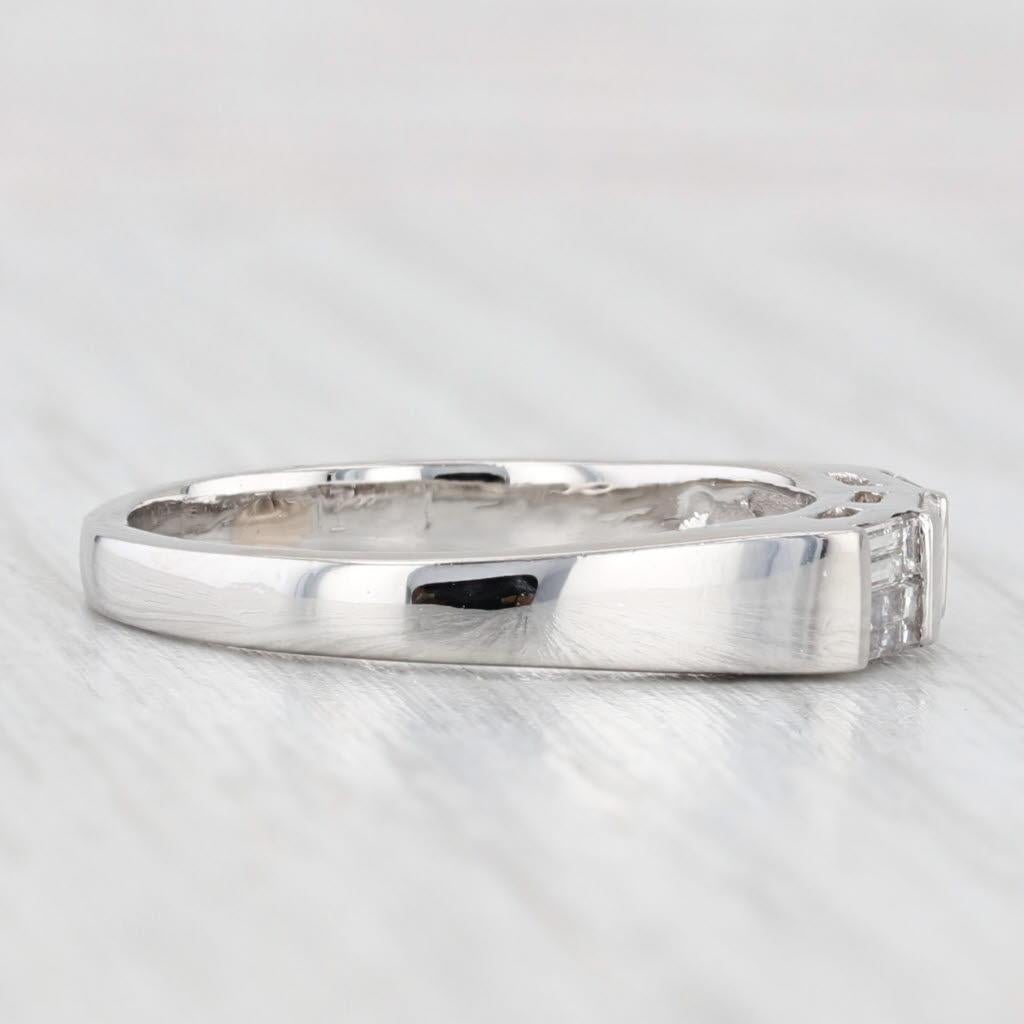 Gemstone Information:
- Natural 0.52ctw -
Total Carats - Baguette
Cut - Baguette
Color - G - H
Clarity - VS1 - VS2

Metal: Platinum 
Weight: 5.8 Grams 
Stamps: Platinum
Face Height: 3.8 mm 
Rise Above Finger: 3.7 mm
Band / Shank Width: 2.2 mm

This