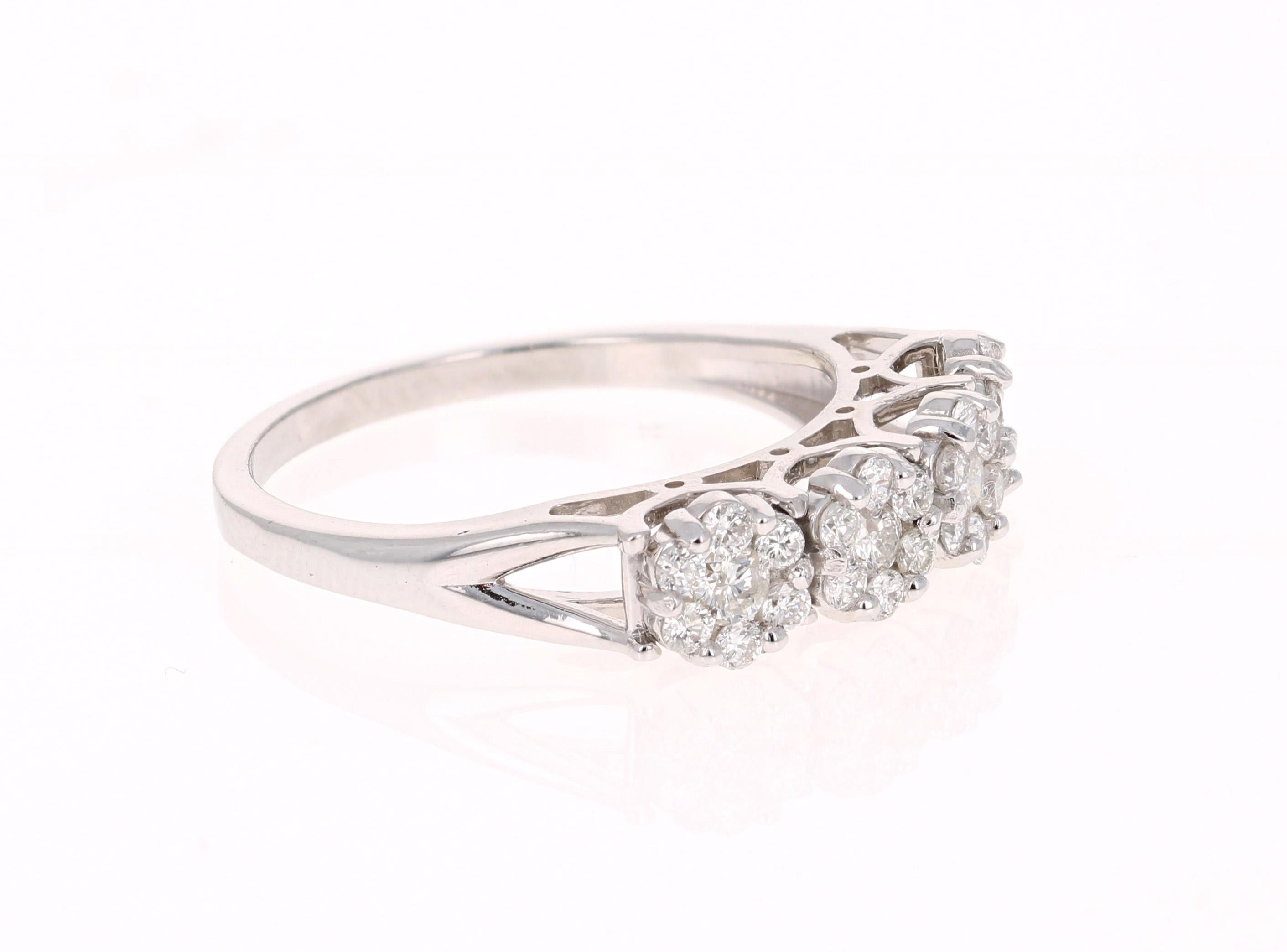 This ring has a flower design and has 28 Round Cut Diamonds that weighs 0.53 Carats. 

It is beautifully set in 14 Karat White Gold and weighs approximately 2.6 grams

The ring is a size 6 3/4 and can be re-sized free of charge. 

