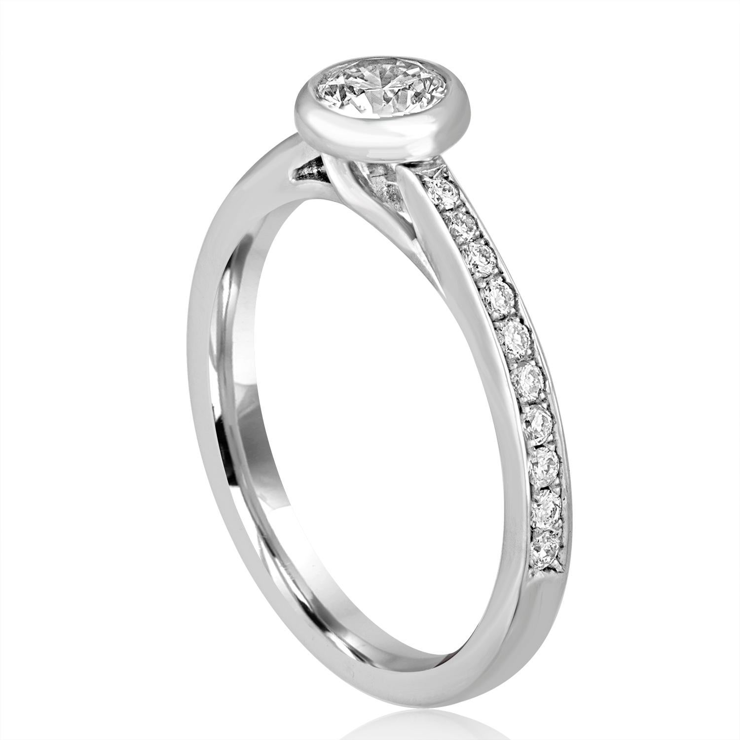 The ring is 18K White Gold
The center stone is 0.53 Carats F SI2
The center stone is set in a gold bezel
The small diamonds on the side 0.27 Carats F SI2
The ring is a size 8, sizable
The ring weighs 3.6 grams