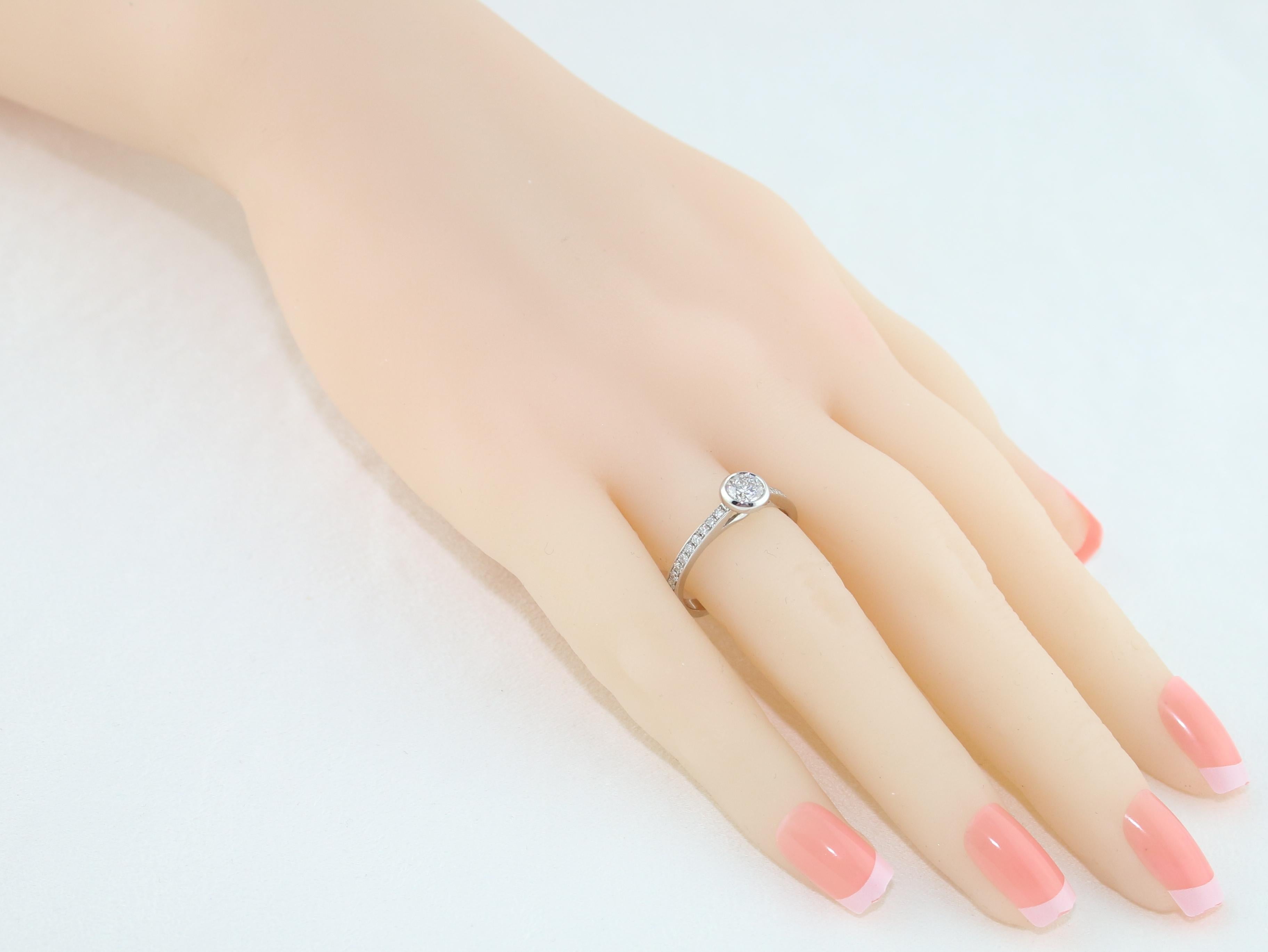 Round Cut 0.53 Carat Diamond Bezel Gold Engagement Ring For Sale