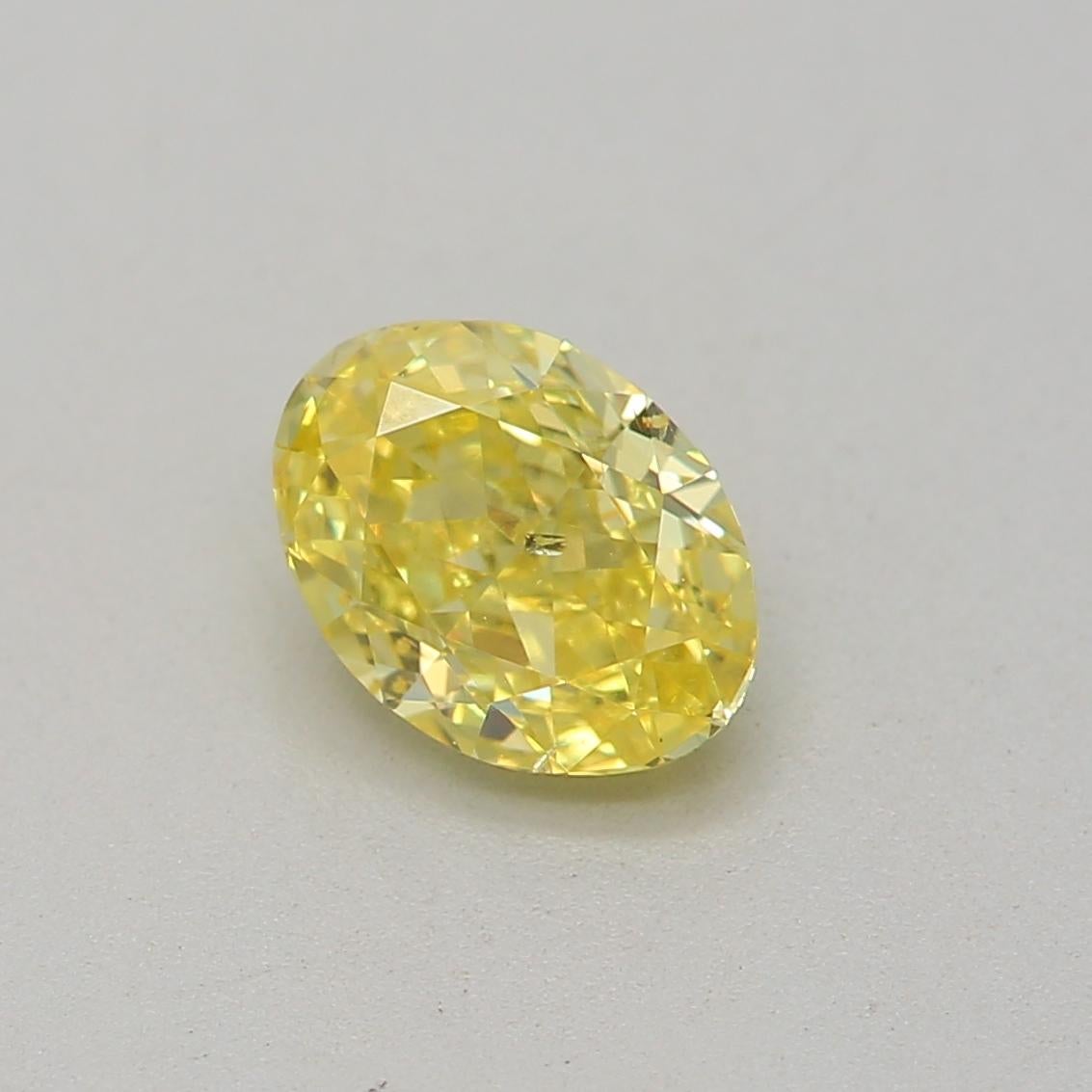 0.53 Carat Fancy Intense Yellow Oval cut diamond SI2 Clarity GIA Certified For Sale 1