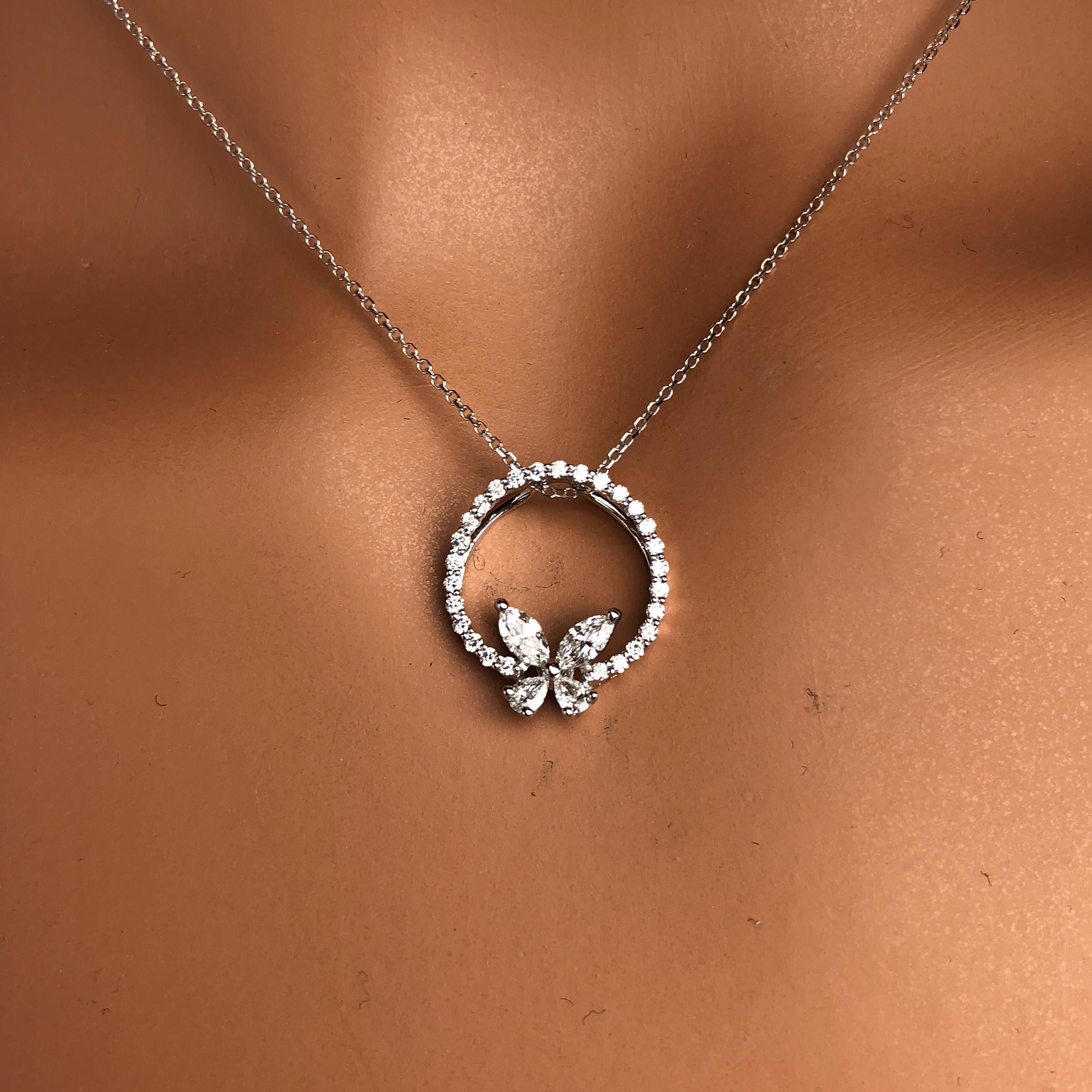 Experience the enchantment of our delicate Diamond Butterfly Pendant, where the ethereal beauty of nature meets the brilliance of fine jewelry. A butterfly, delicately crafted from shimmering pear and marquise diamonds, is gracefully perched on a
