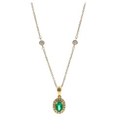0.53 Carat Oval Cut Emerald Diamond Accents 10K Yellow Gold Pendant