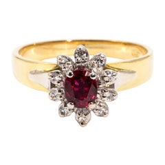 0.53 Carat Red Natural Oval Ruby and Diamond Cluster Ring in 18 and 9 Carat Gold
