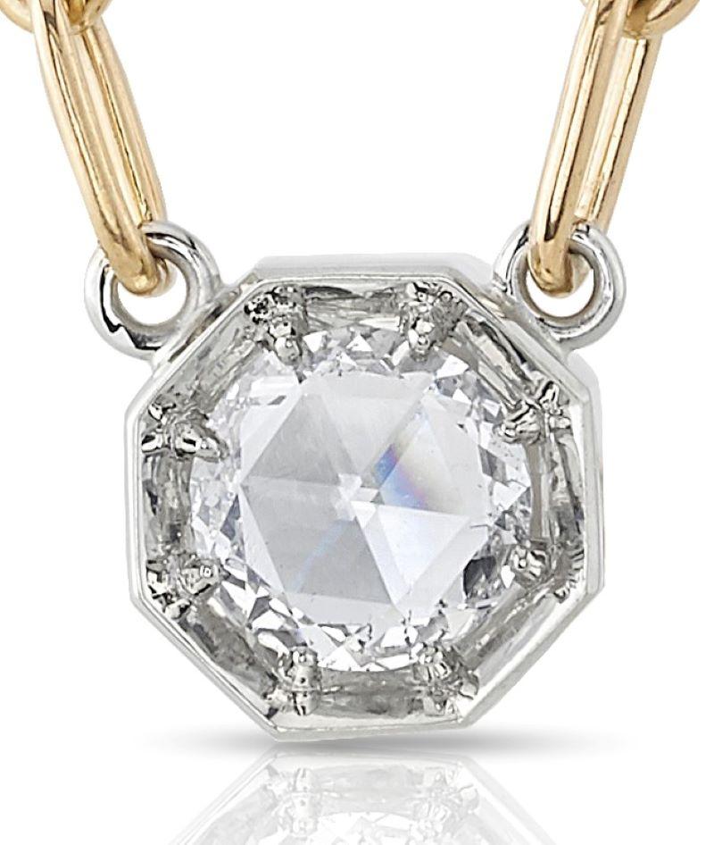 0.53ctw G/SI2 GIA certified Rose cut diamond set in a handcrafted 18K champagne gold pendant. Pendant is set on a handcrafted 18K yellow gold bond chain.

Necklace measures 17