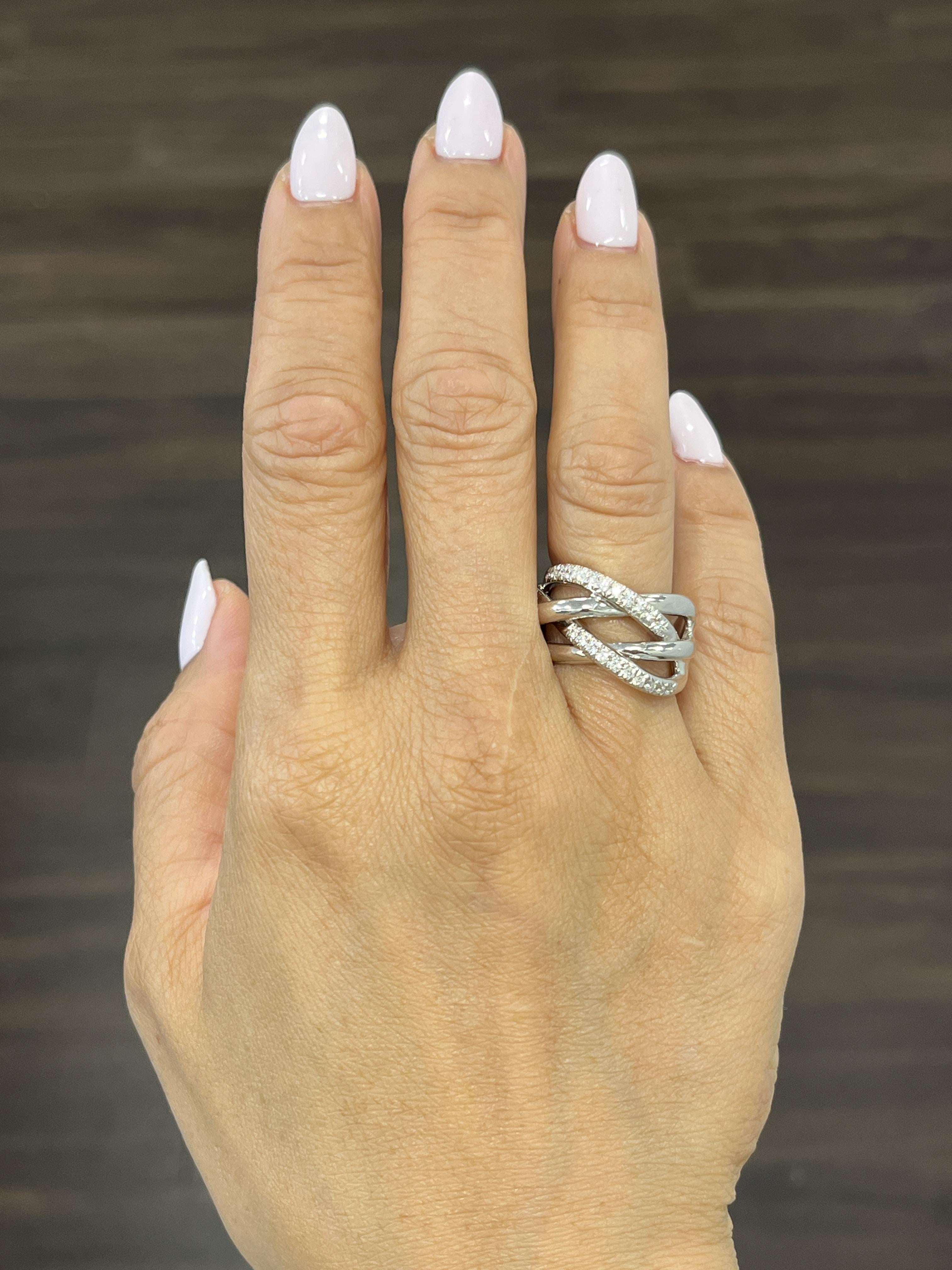 This modern 18k white gold fashion ring features 24 stunning round-cut diamonds with a carat weight of 0.53. The diamond is of G/H color grade and VS2/SI1 clarity, ensuring a brilliant white sparkle. Crafted in the United States, the ring is size 6