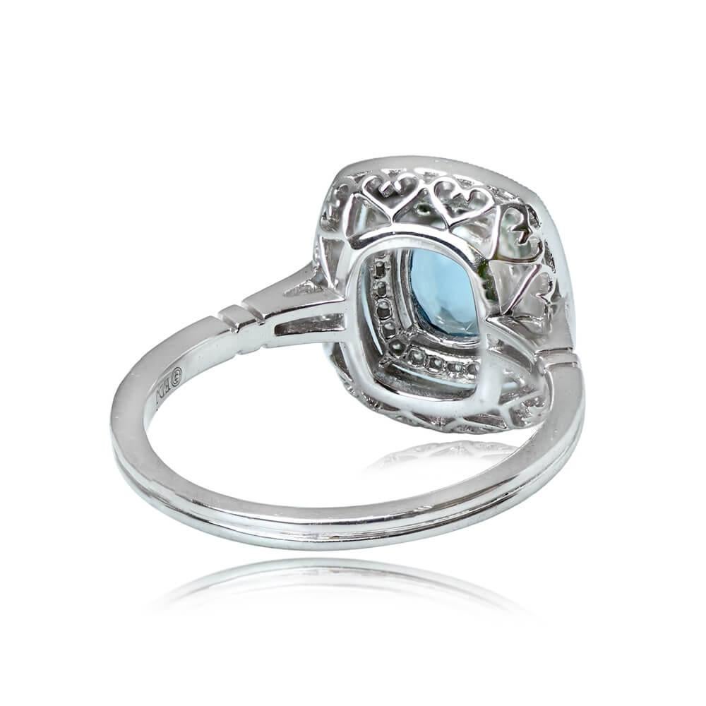 Birthstone Engagement Ring: This enchanting piece highlights a 0.53-carat oval cut aquamarine, elegantly bezel-set and embraced by a double halo of round brilliant cut diamonds. Further adding to its charm, the shoulders are adorned with additional