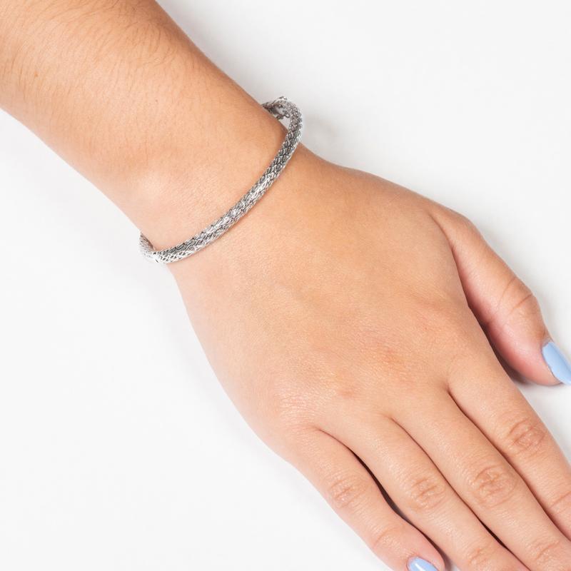 This bangle bracelet is made of 14kt white gold and has a 0.53ct total weight in round diamonds going about halfway around the bracelet. You can wear this bracelet on its own, or you can layer it with other bangle bracelets! The bracelet is a size