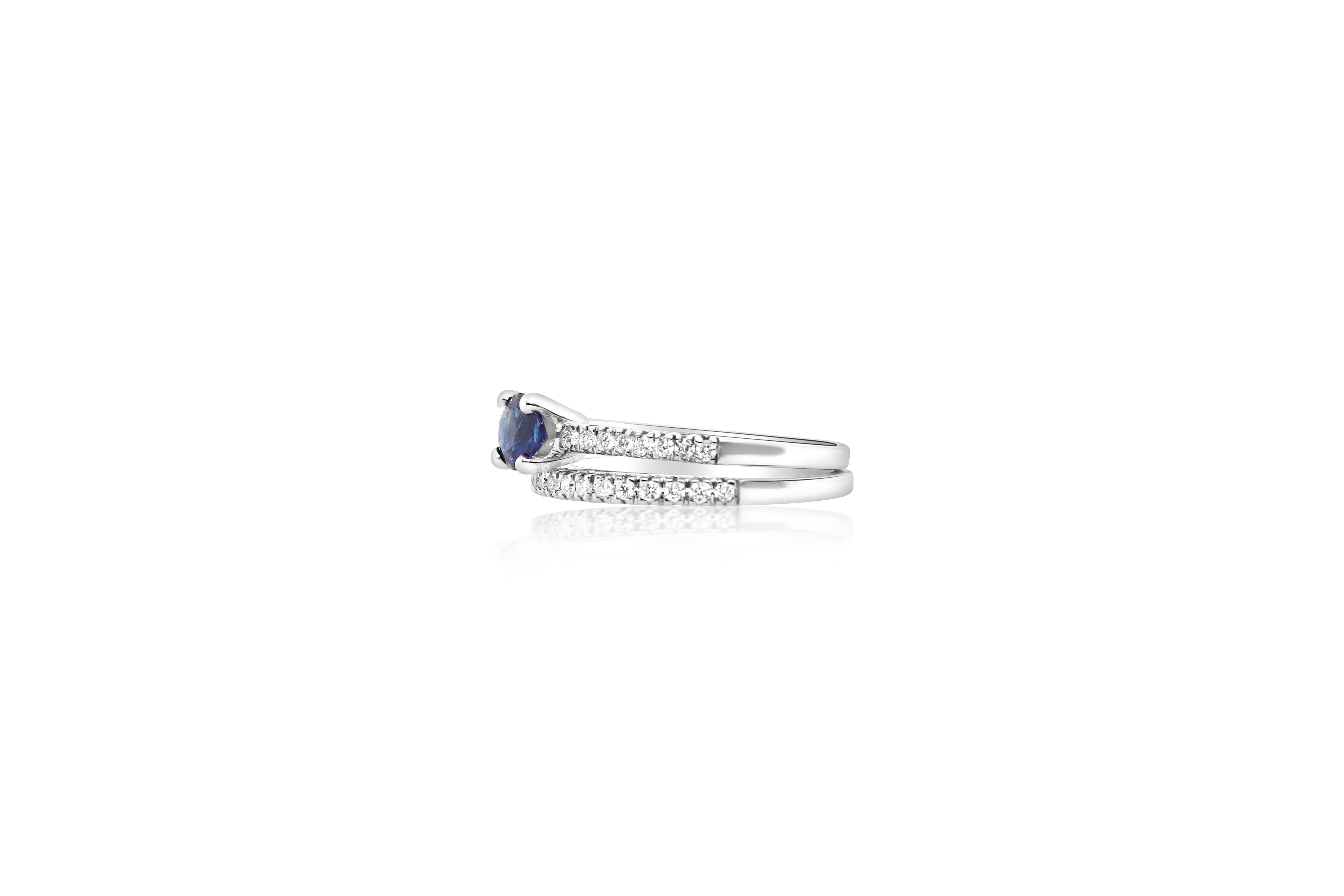 This beautiful 0.54 Carat Blue Sapphire rings a is complemented with a diamond band. Great for stacking or separating to mix and match looks!

Material: 14k White Gold 
Center Stone Details: 0.54 Carat Round Sapphire 
Mounting Diamond Details: 32
